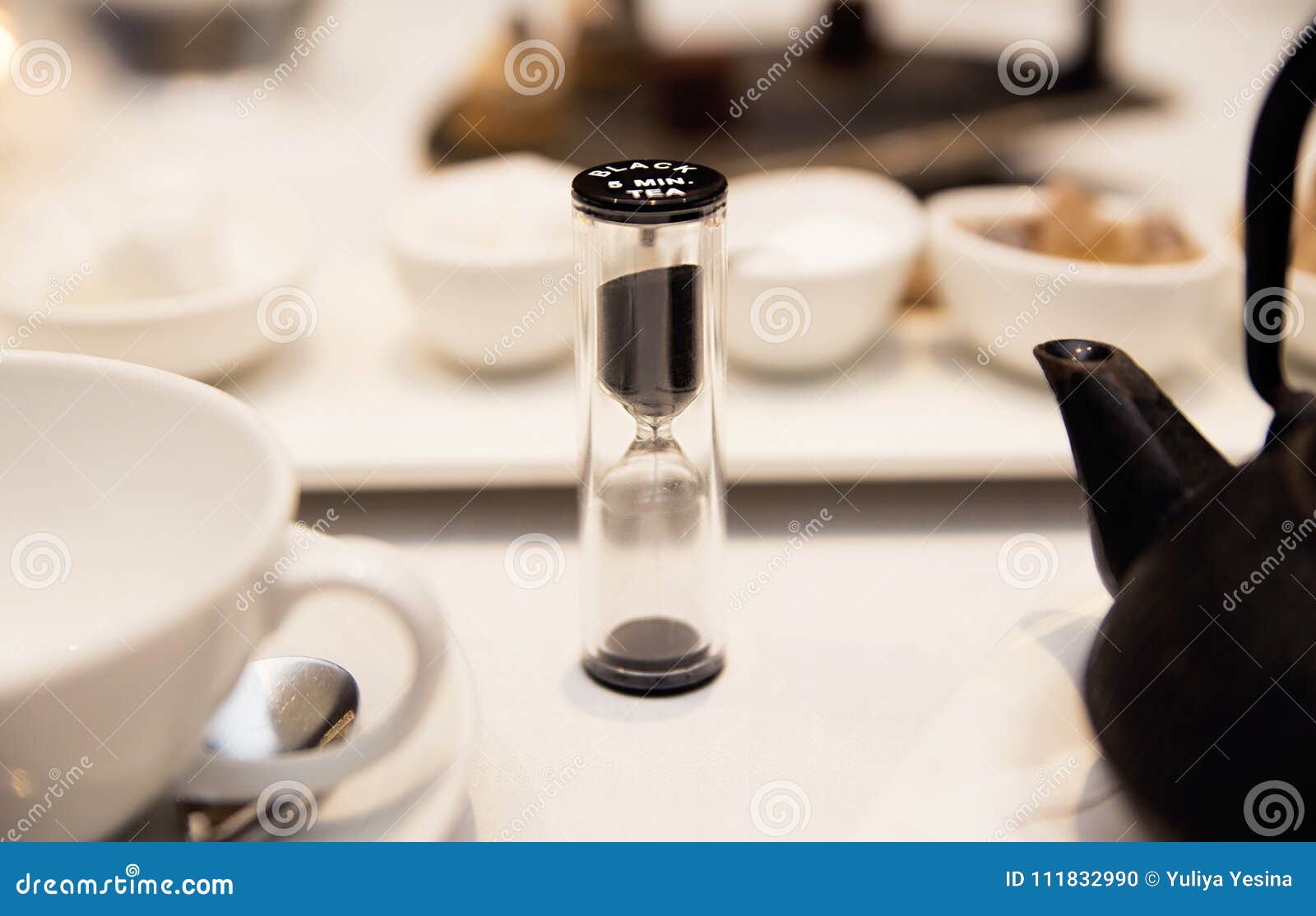 Set for Tea in the Restaurant and Hourglass Stock Photo Image of sand