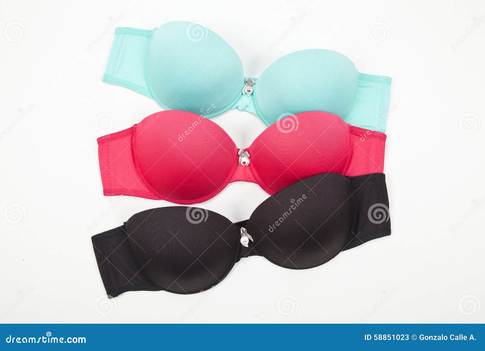 Set of Three Bras in Different Colors on White Background Stock Image