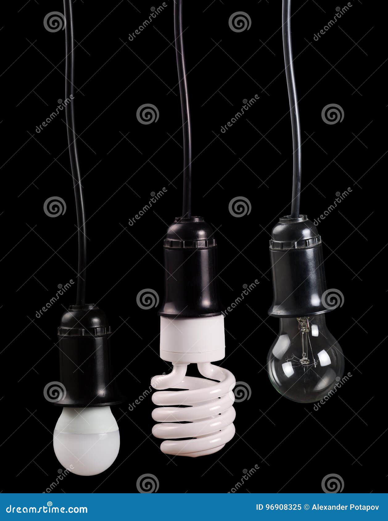 set of three electric lamps in receptacle on black