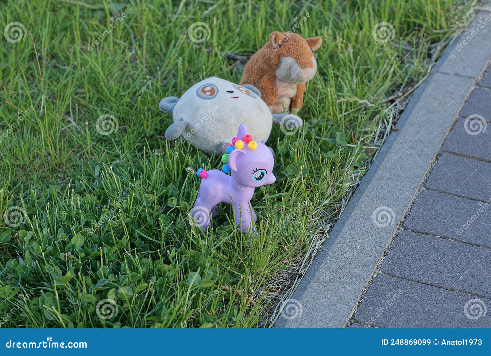 A Set Of Three Toys With A Purple Plastic Unicorn And Teddy Bears Stock Image Image Of Design