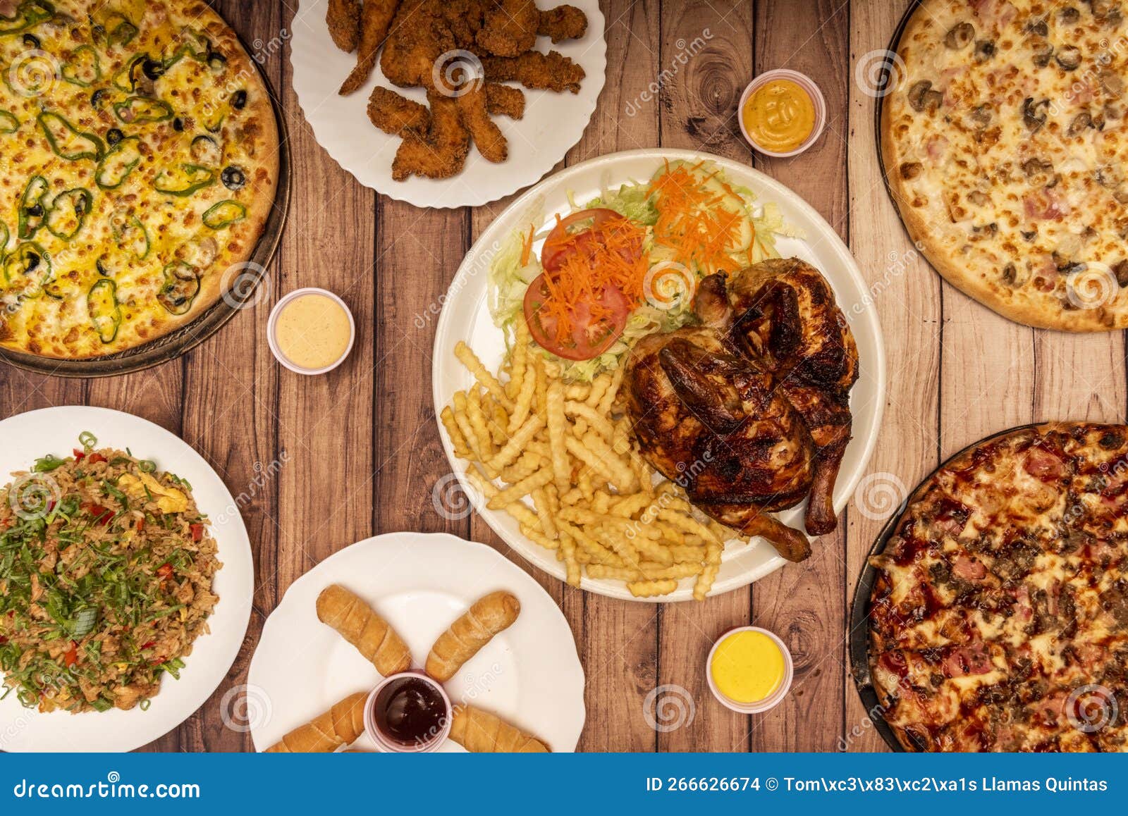 set of varied fast food dishes, various pizzas, carbon-roasted chicken with fries and salad, fried rice, teques and fried chicken