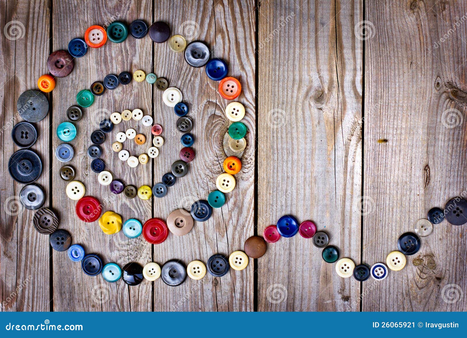 Lots of colorful buttons for clothes on wooden background