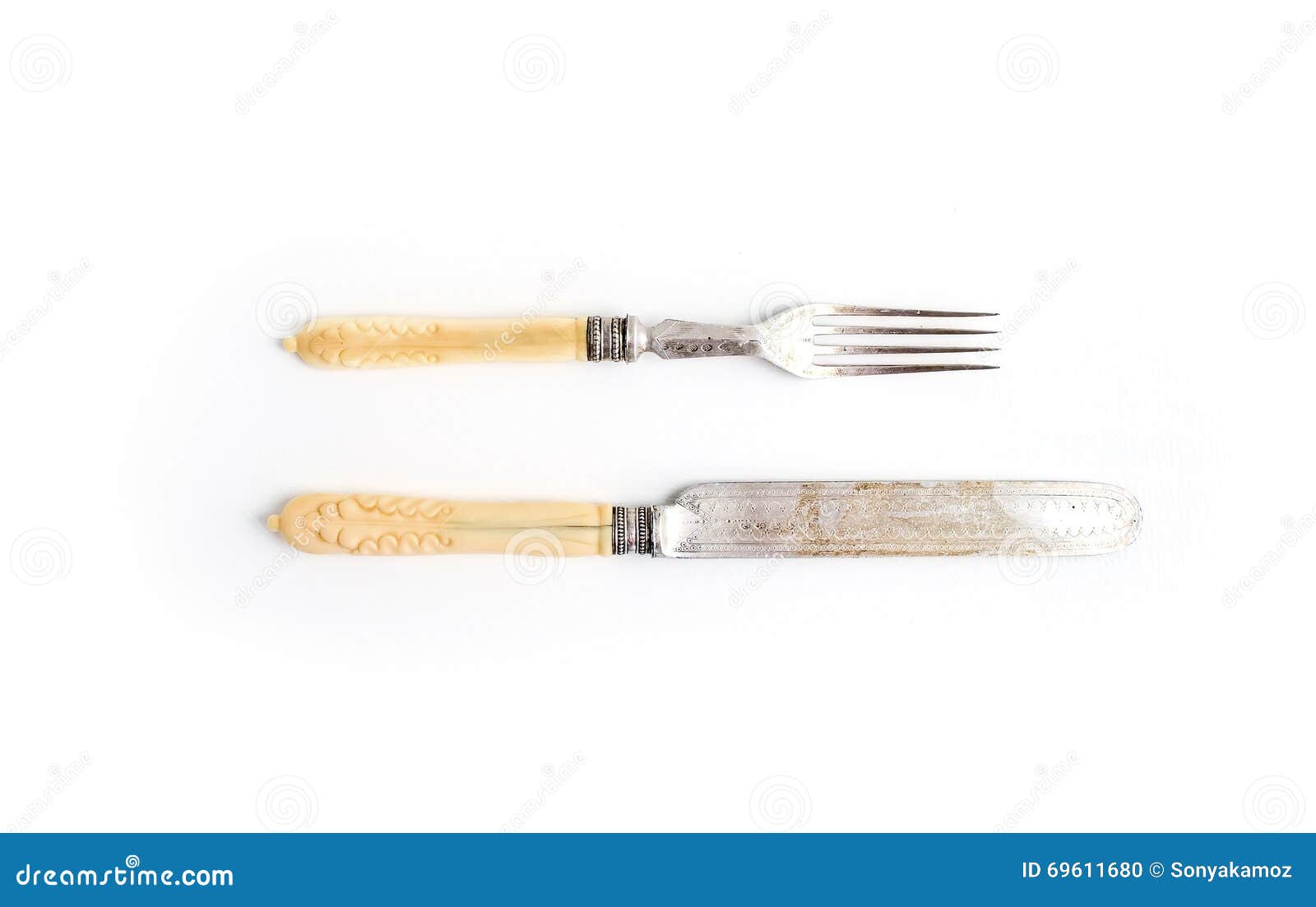 Set Of Vintage Dinnerware. Knife And Fork With Bone Handles On A White