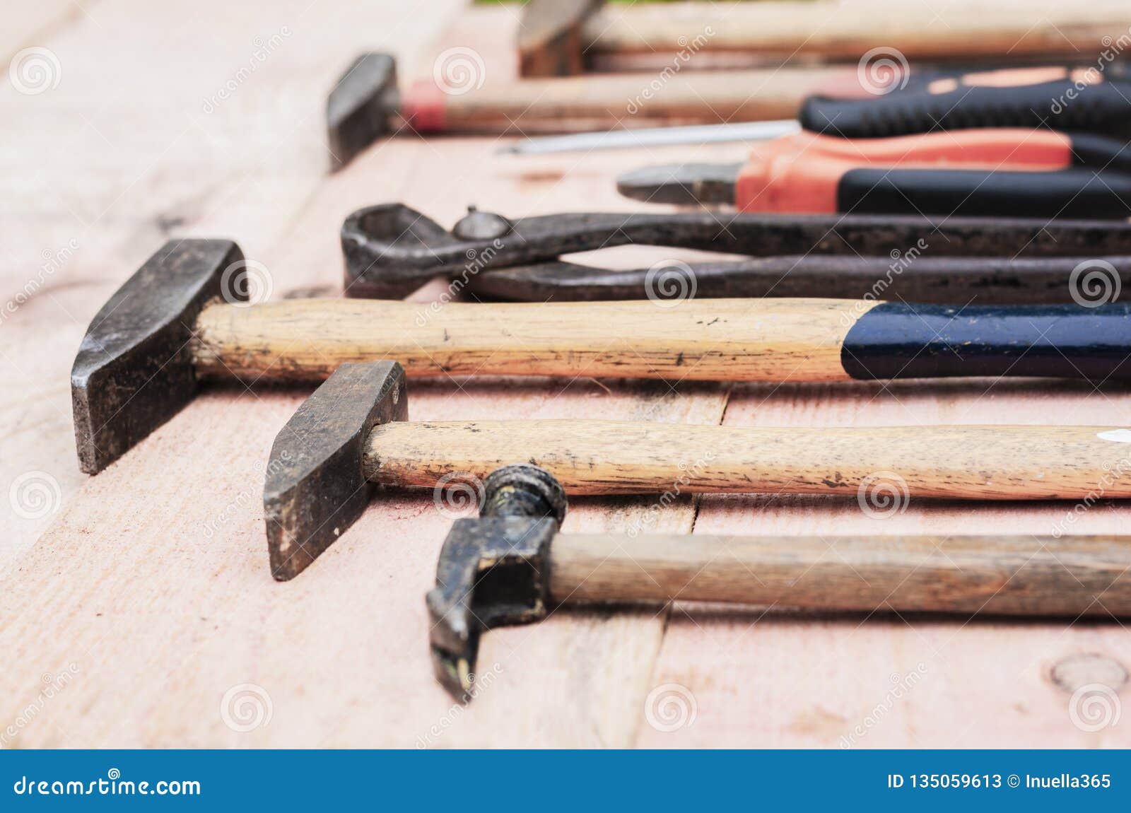 Set of Vintage Hand Construction Tools on a Wooden Background Stock