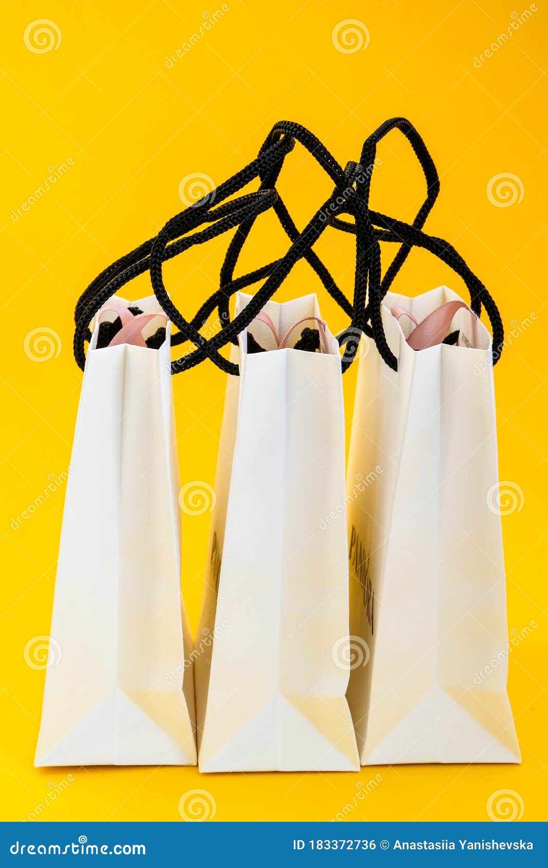 Download Set Of White Paper Bags For Shopping On Yellow Background ...