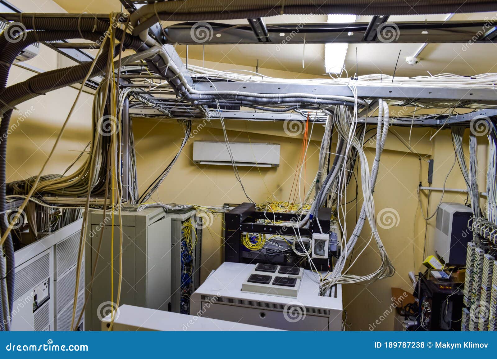 A Set Of Wires And Cables Intertwined In Datacenter Server Room. Top