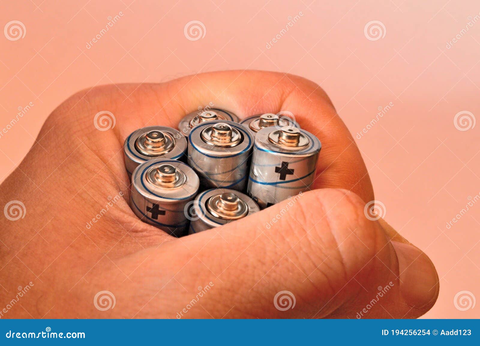 Seven AA Batteries in Hand. Stock Photo Image of pile, renewable