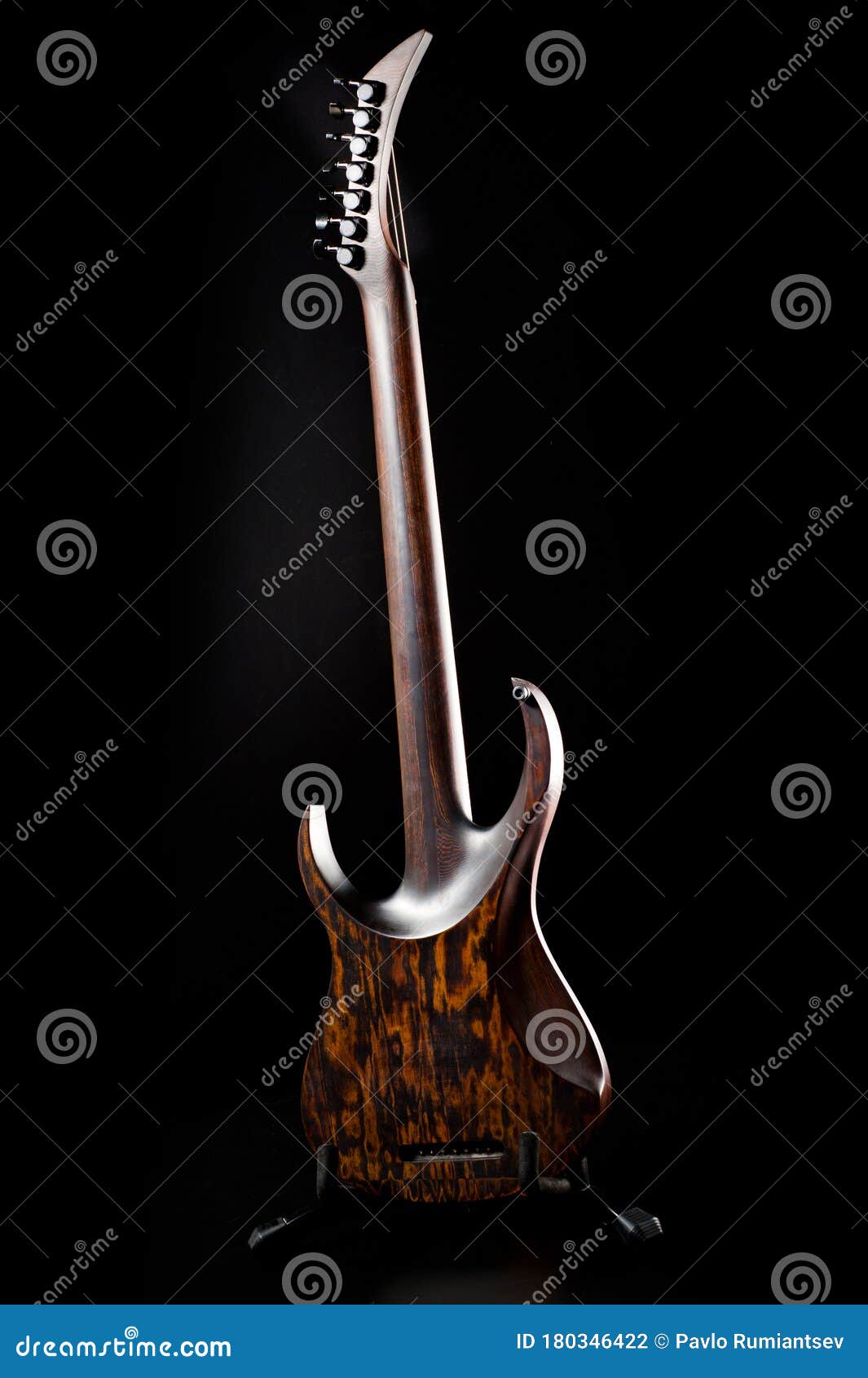 Sevenstring Electric Guitar Made of Dark Wood. Background for Music