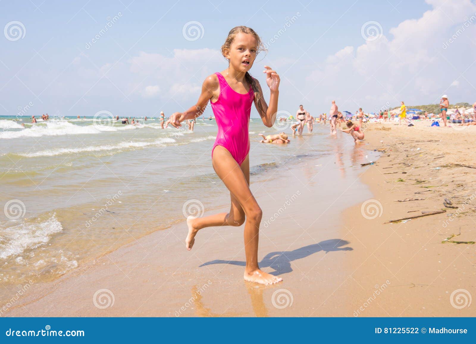 Seven year Girl Runs on Beach from the Sea Stock Photo Image of