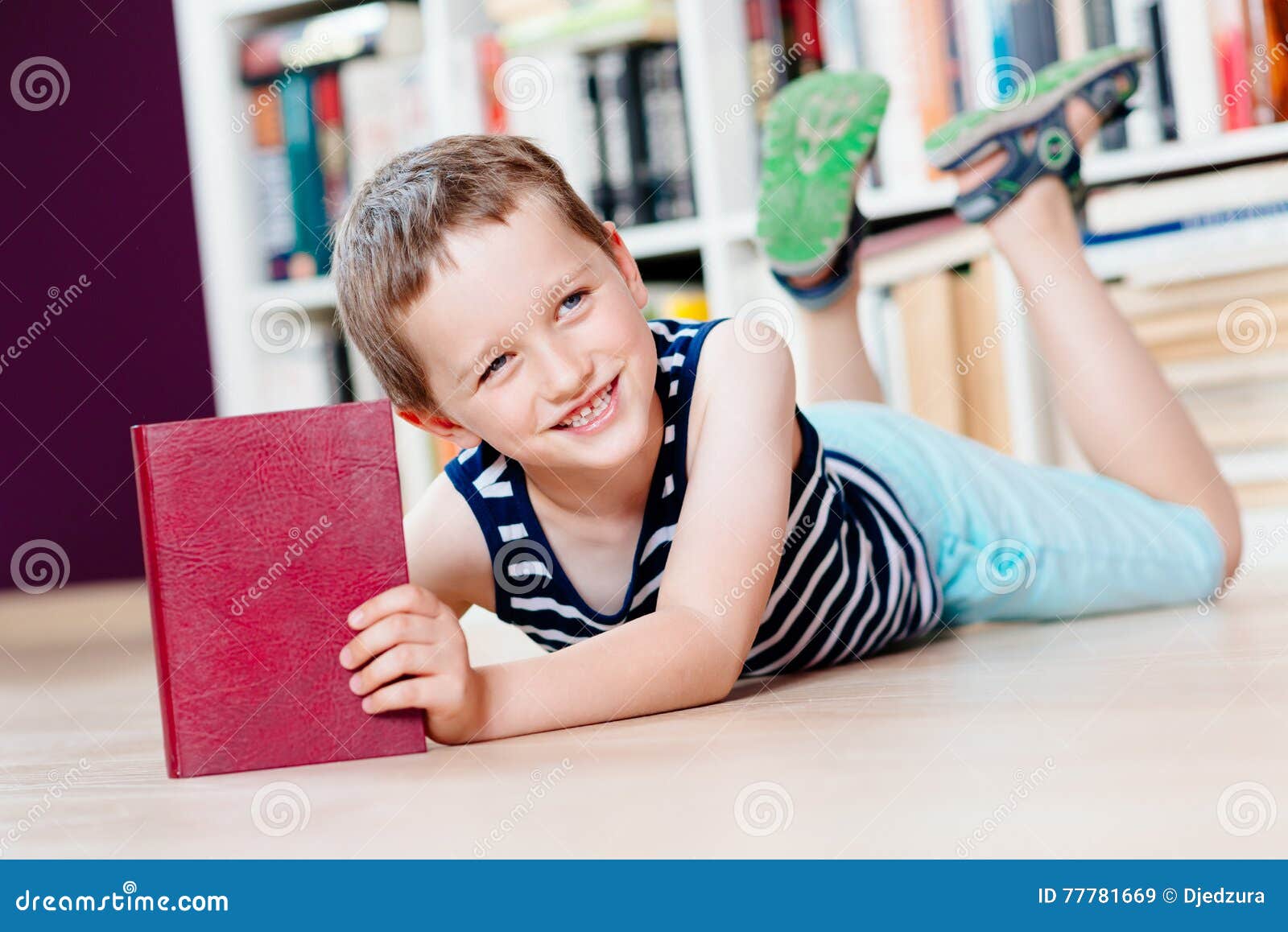 Seven Years Old Boy Reading a Book in Library. Stock Image Image of