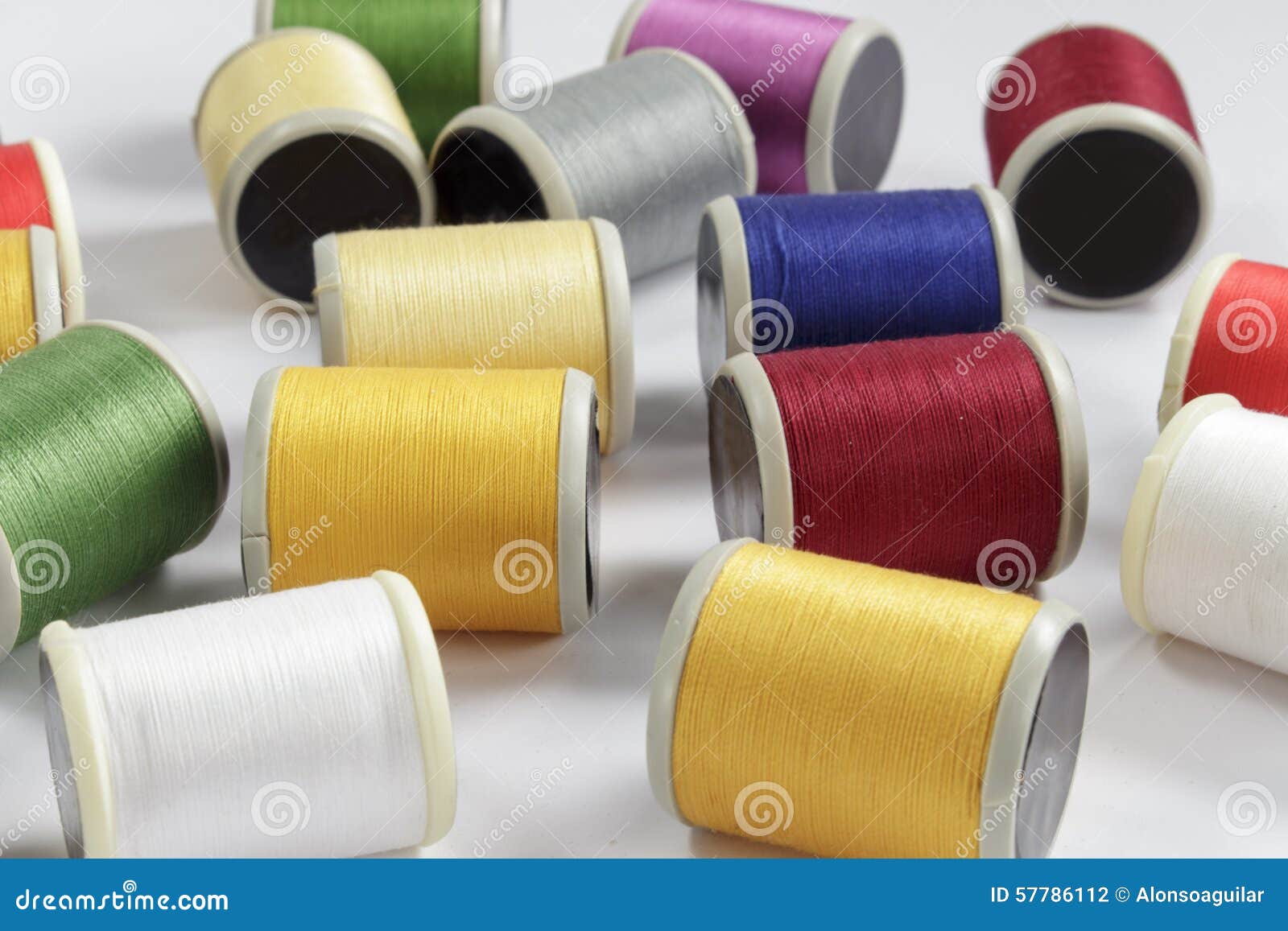 Several Bobbins of Cotton Thread for Sewing Machines Stock Photo