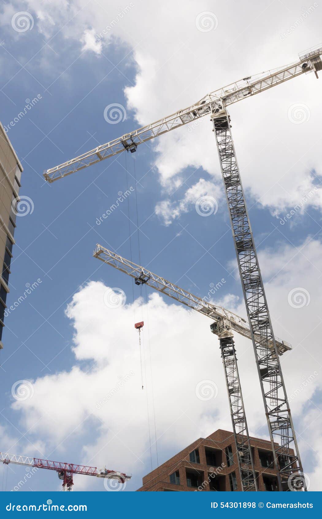 Several Building Cranes Working at Noon Stock Photo Image of clouds