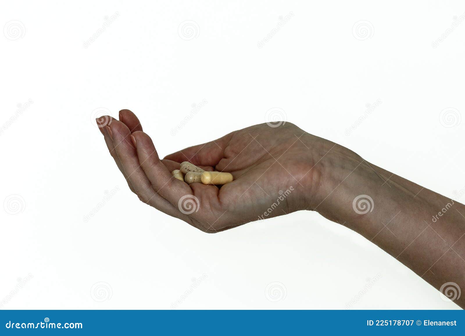 several capsules pills in a woman`s hand, 