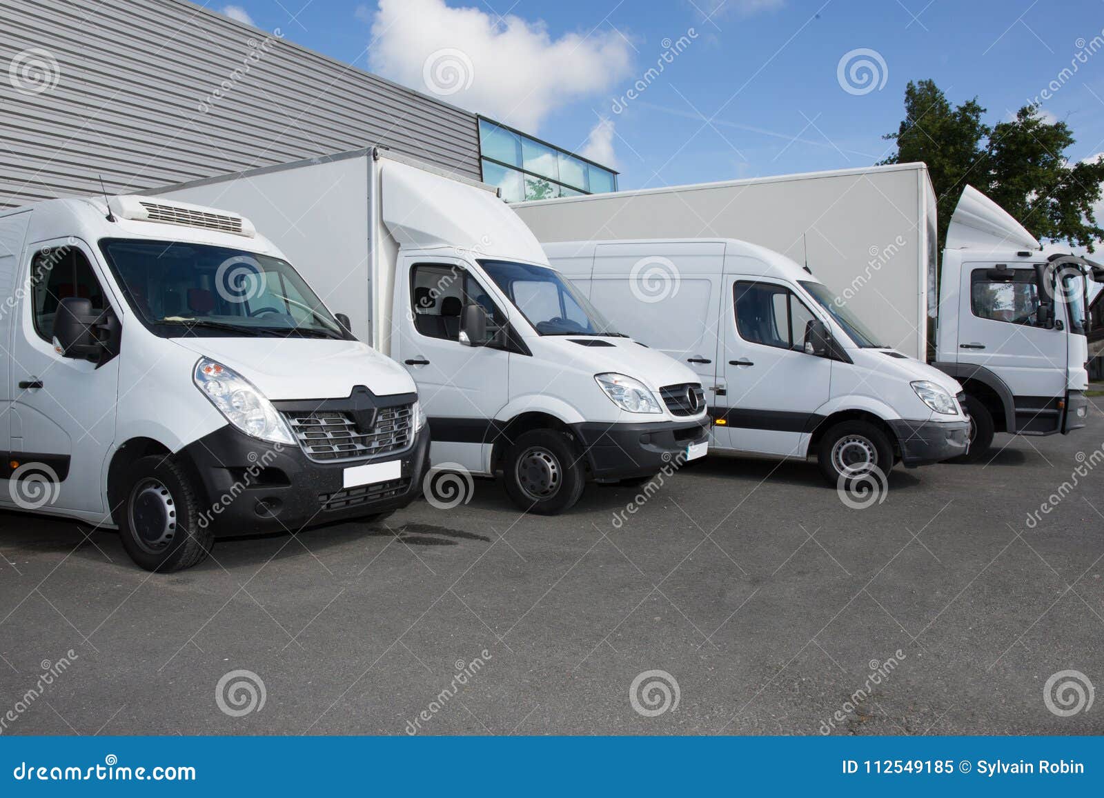 several cars vans trucks parked parking lot sale 112549185