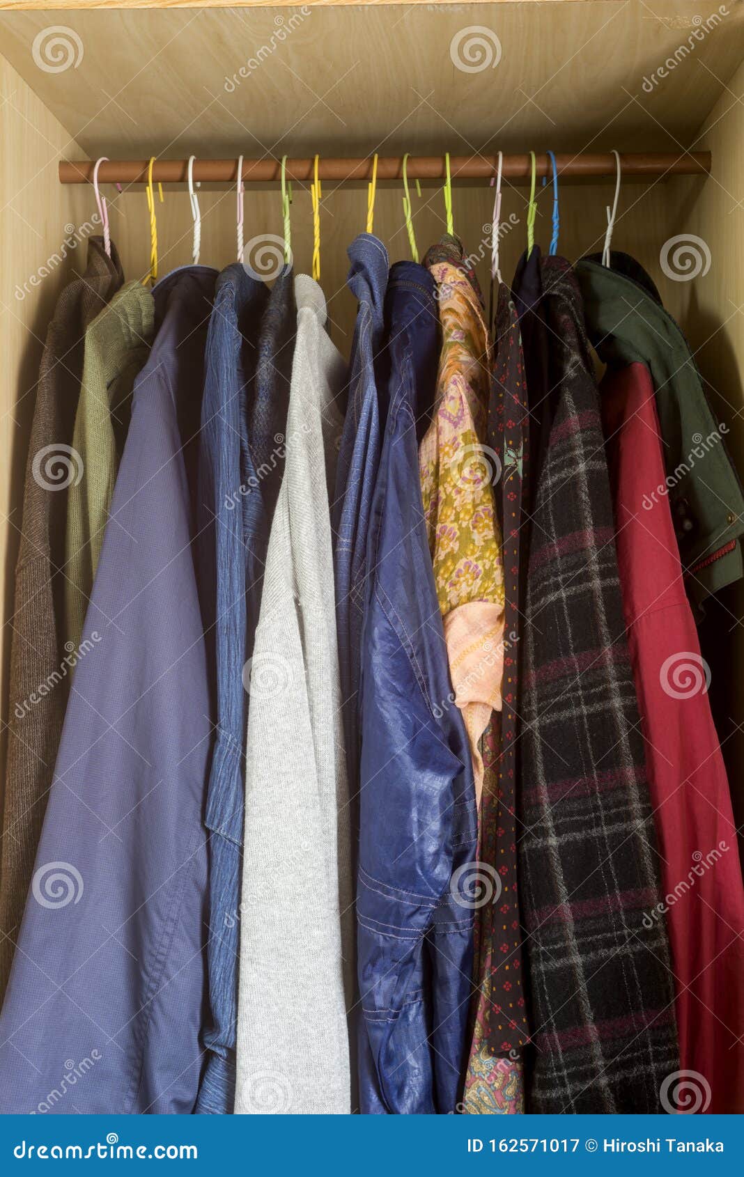 Several clothes lined up stock image. Image of hanger 162571017