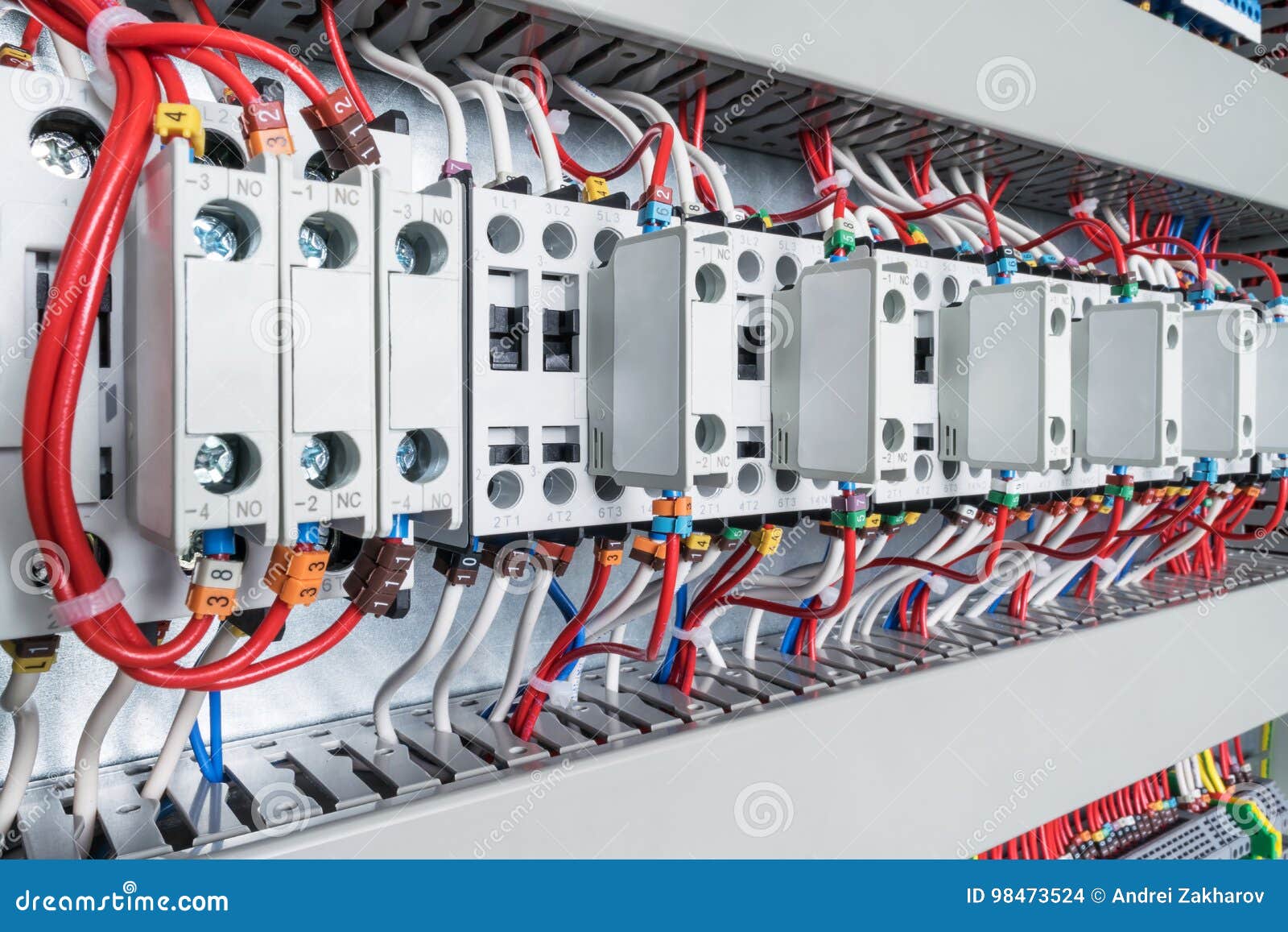 Several Contactors Arranged in a Row in an Electrical Closet. Stock Photo Image of line