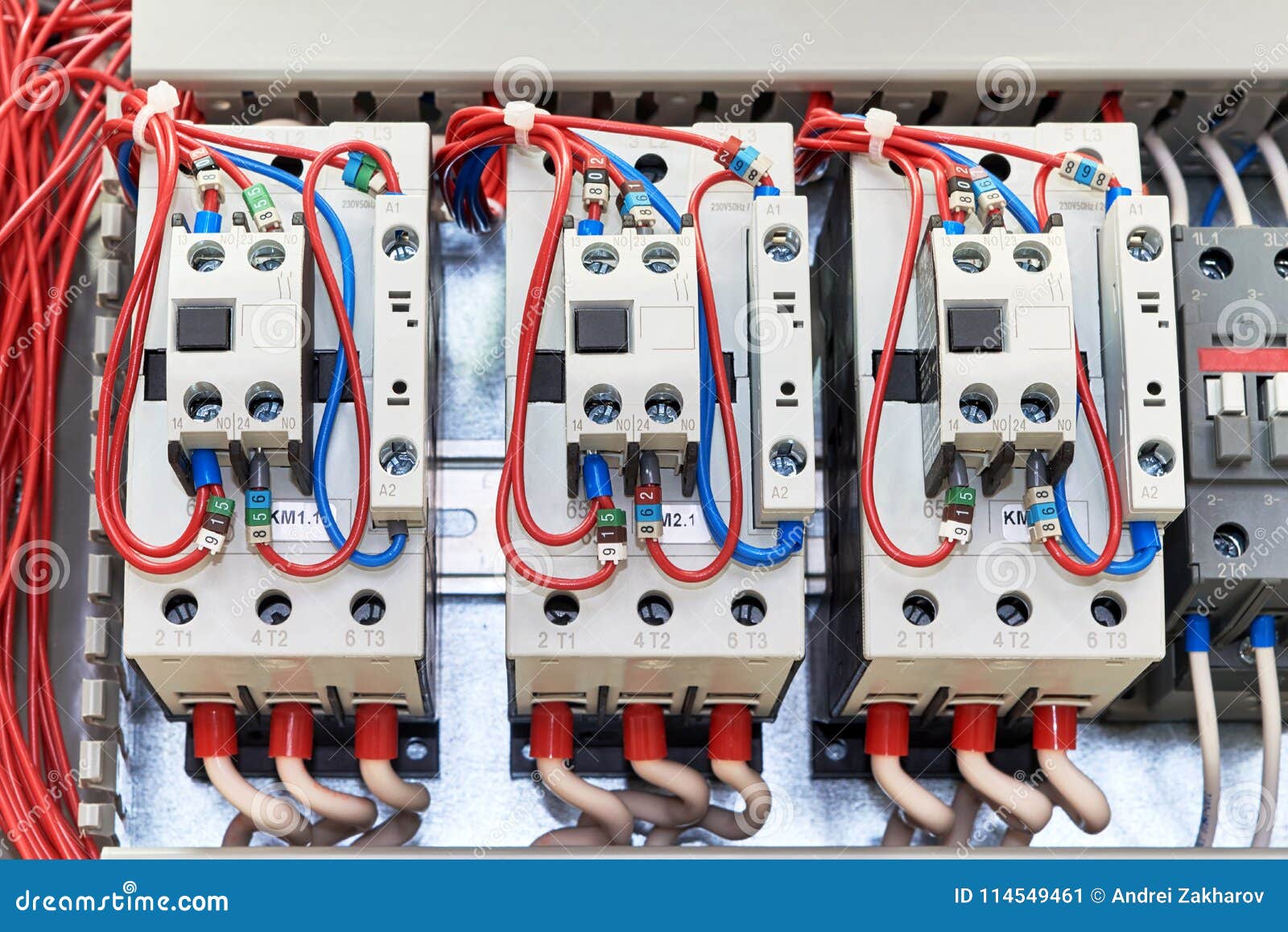 Several Contactors Arranged in a Row in an Electrical Closet. Stock