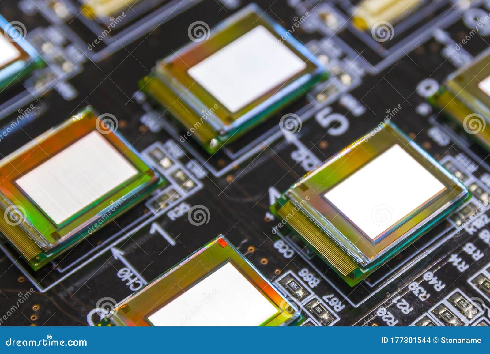 several microdisplays bright of white color on the test station. monitors glow brightly of white color close up.rainbow on surface