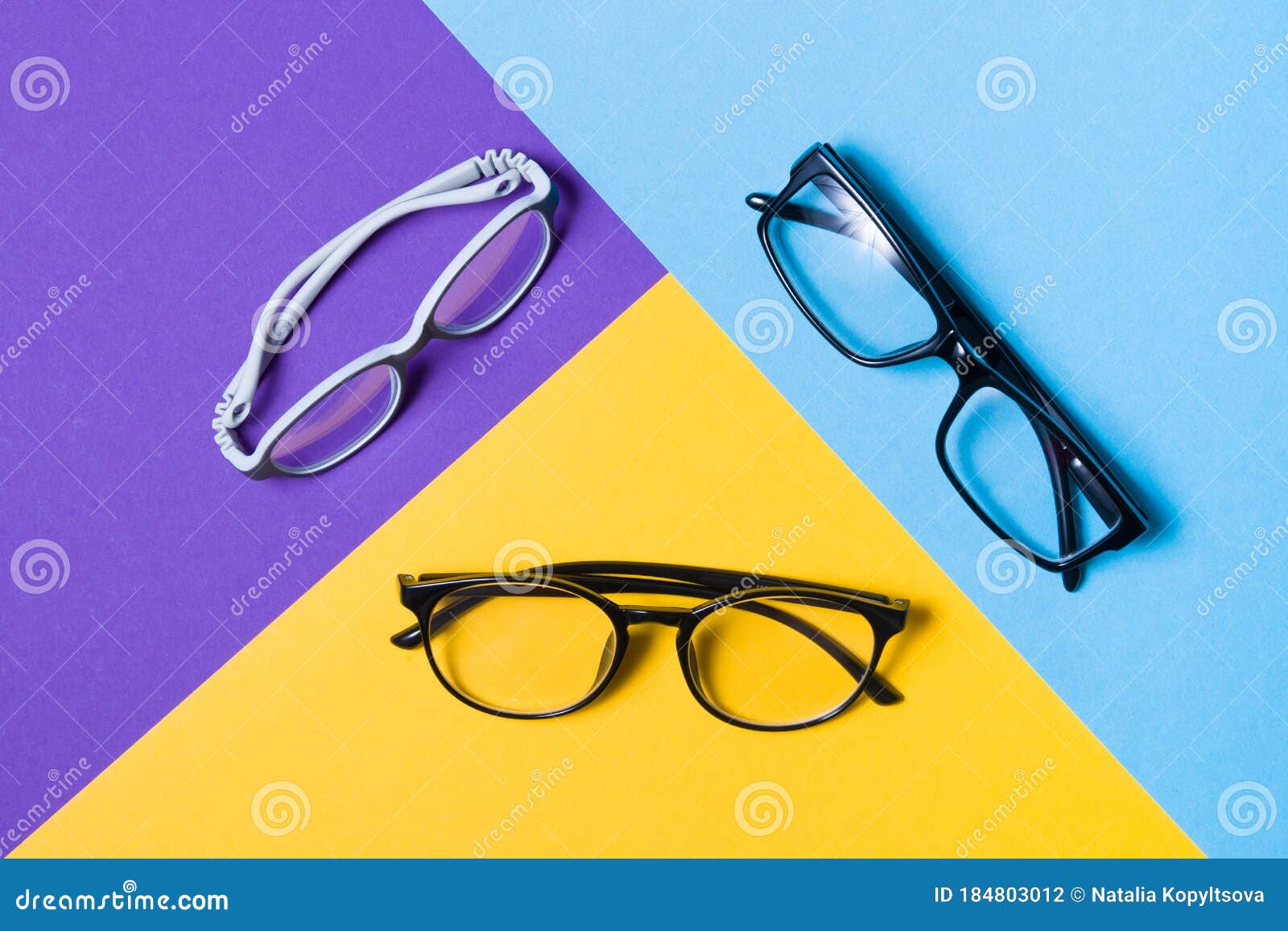 Several Pairs of Glasses Lie on a Colored Background, Glasses for ...