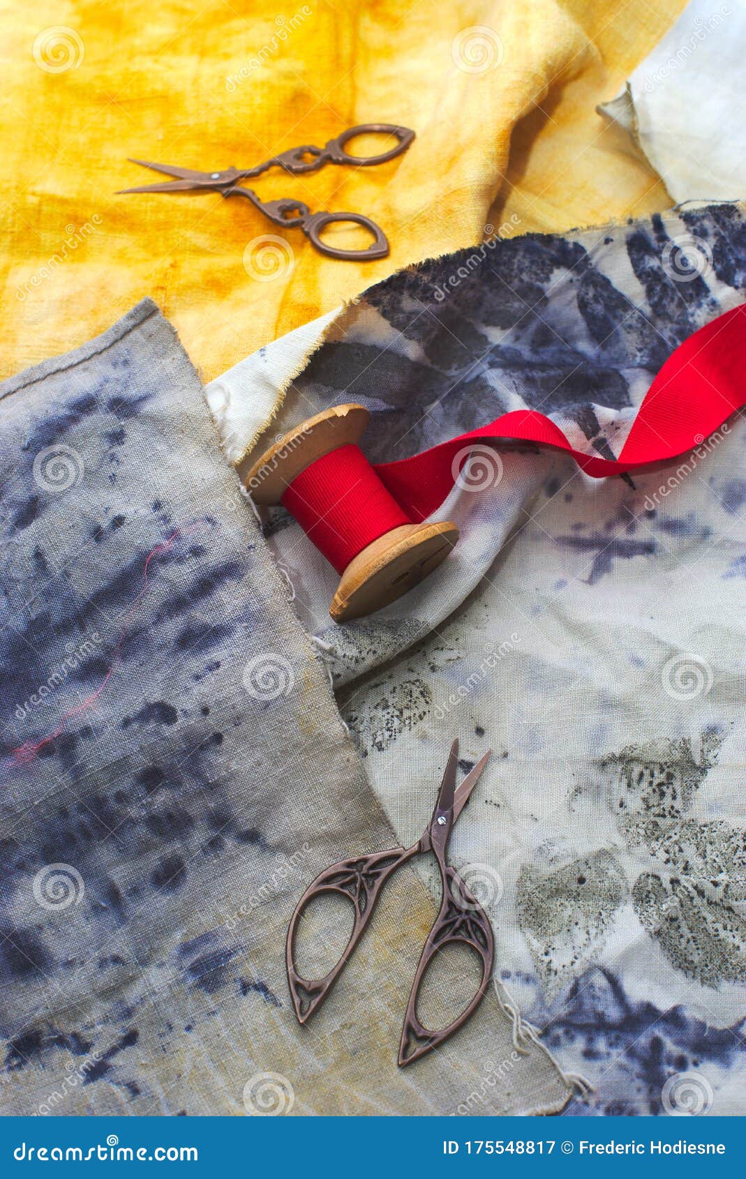 Old Sewing Scissors on Printed Fabrics and Red Ribbon Stock Image