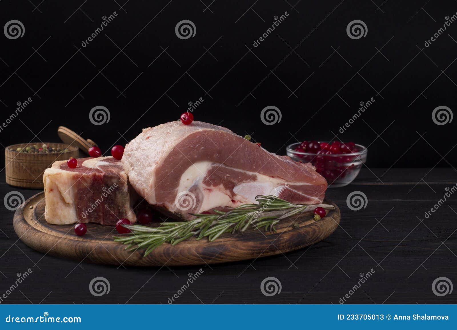 Several Pieces of Raw Beef Brisket on the Bone with Cranberries Stock