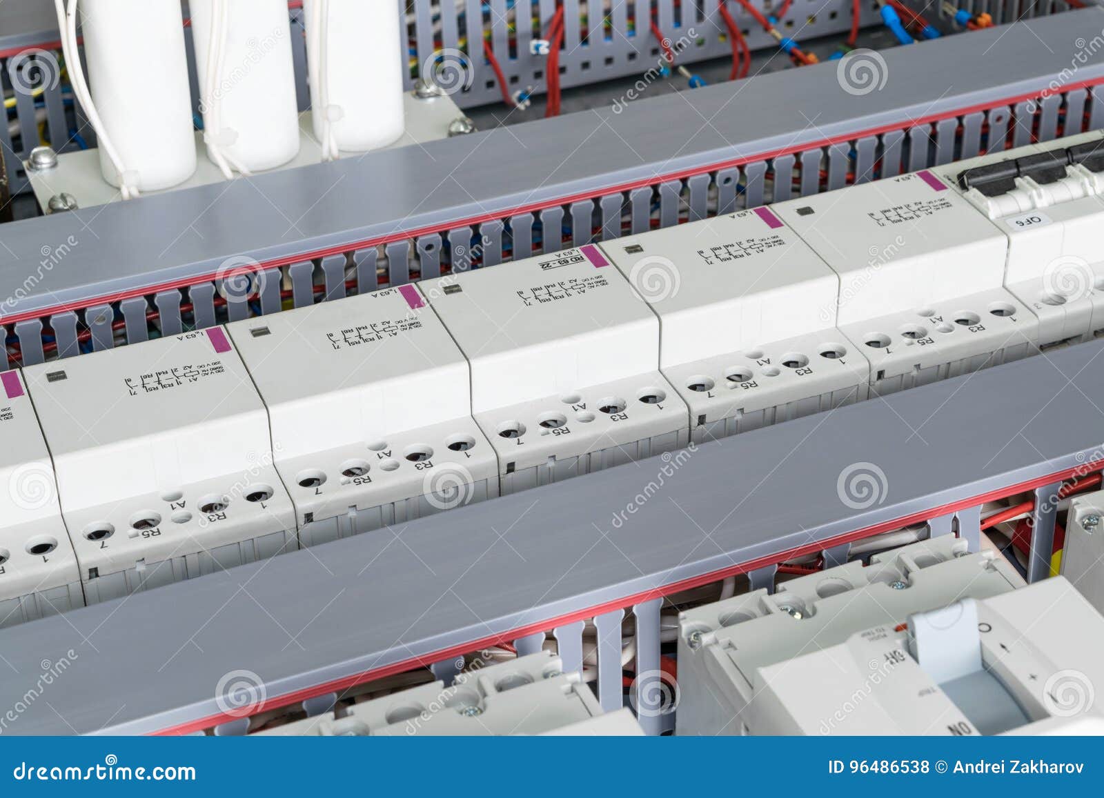 Several power circuit breakers, cable duct for wiring, modular contactors and capacitors.