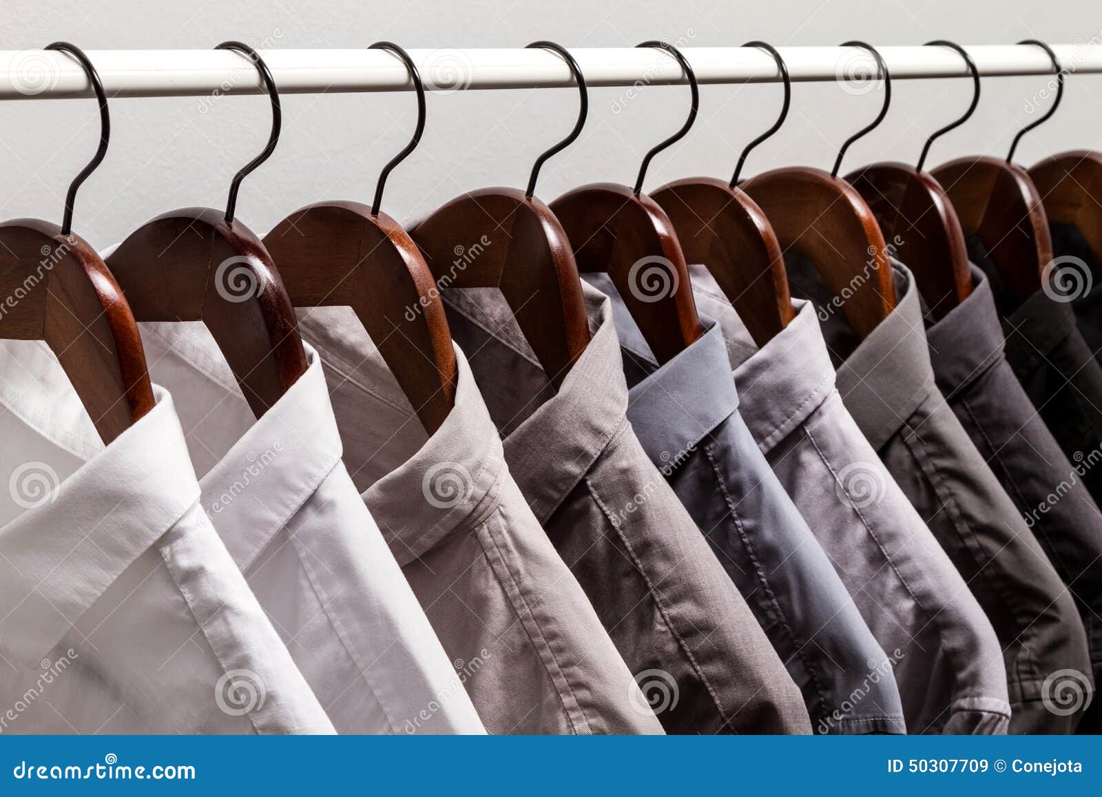 Several shirts on a hanger stock image. Image of organize 50307709
