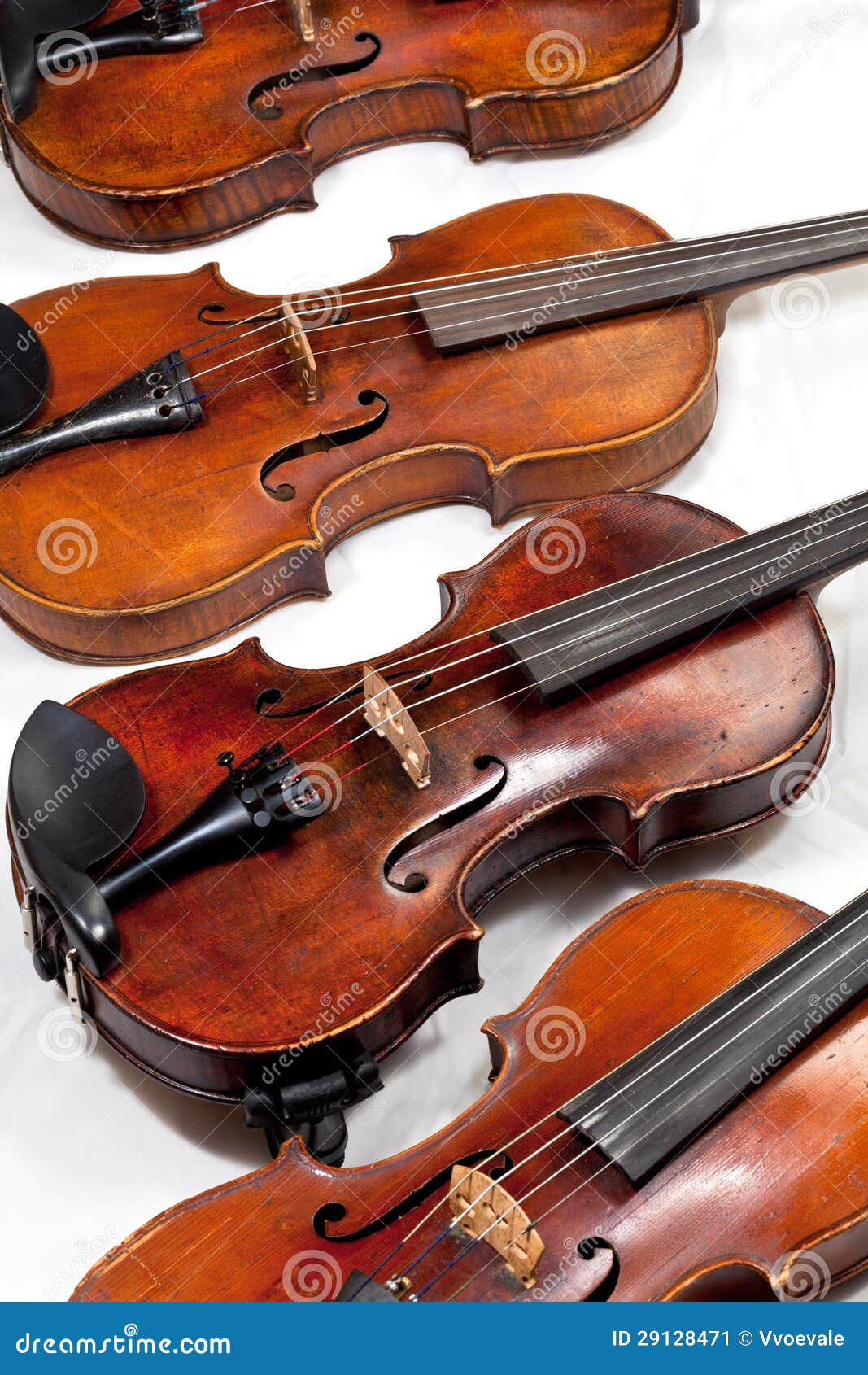 several used fiddles