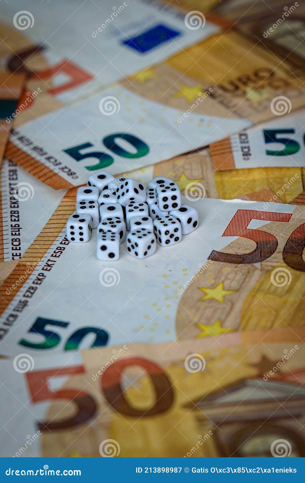 several white dice and euro money