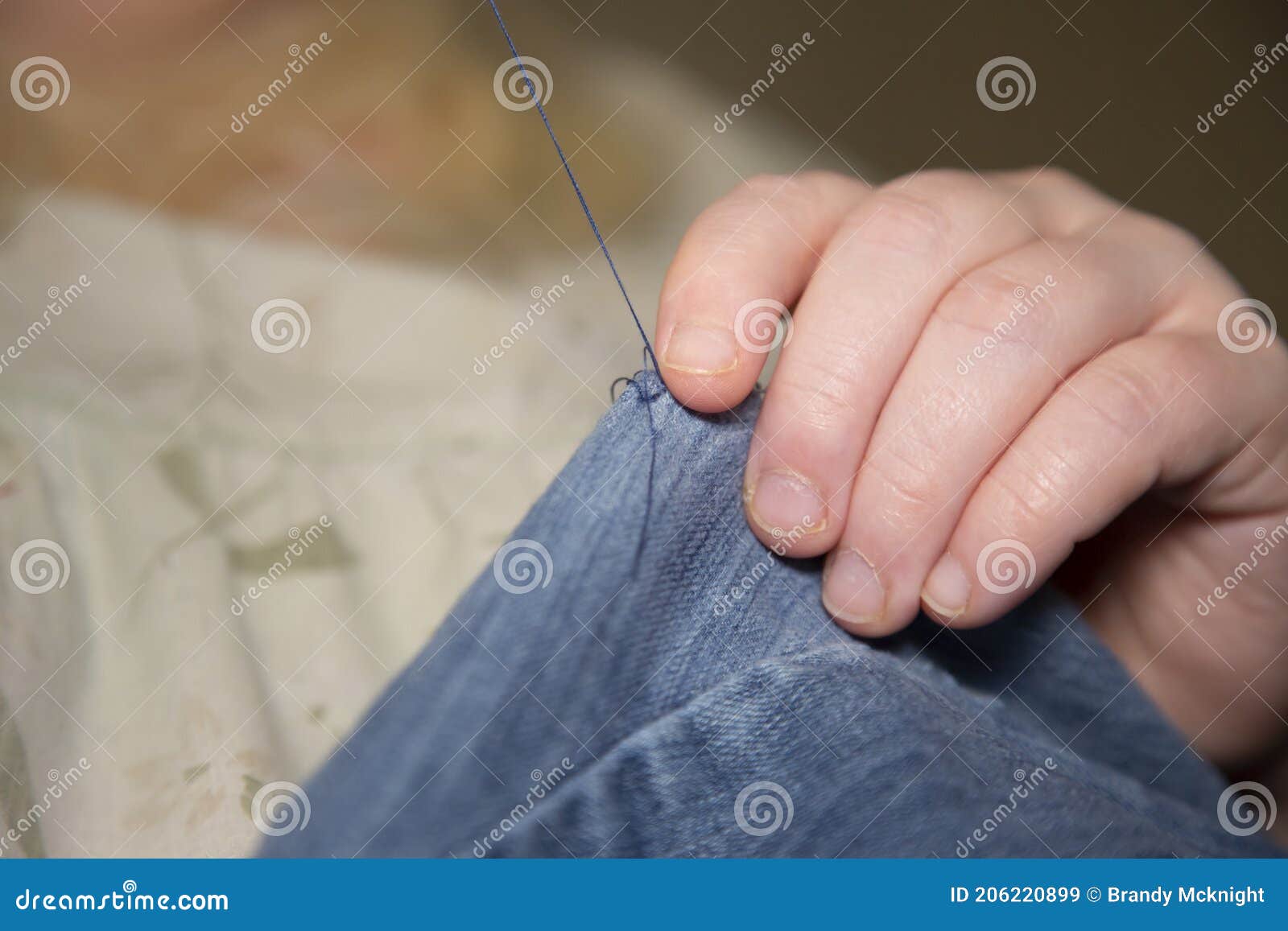 Sewing Blue Jeans stock image. Image of craft, household 206220899