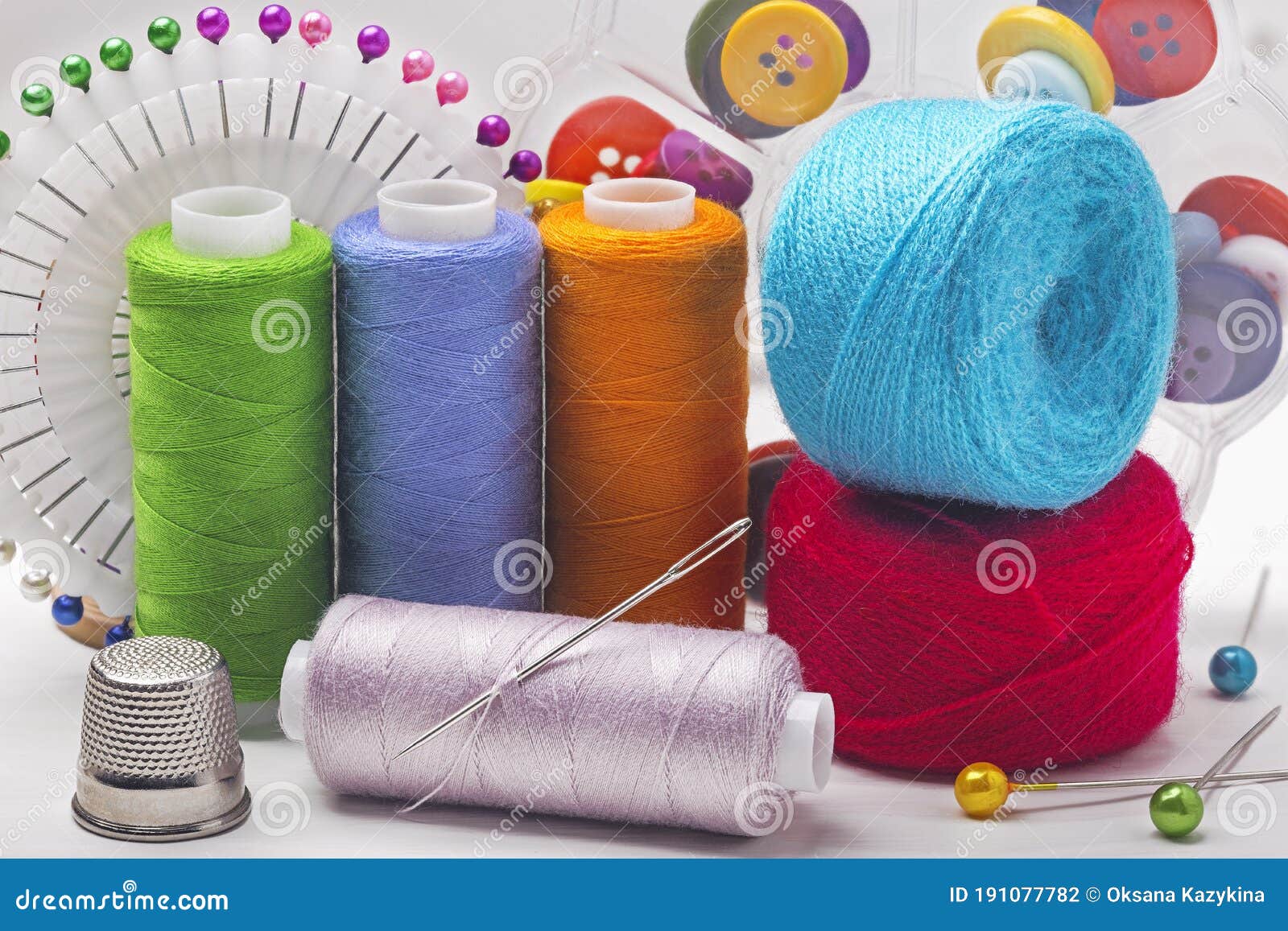 Sewing Kit. Colored Thread Spools and Sewing Needles Stock Photo