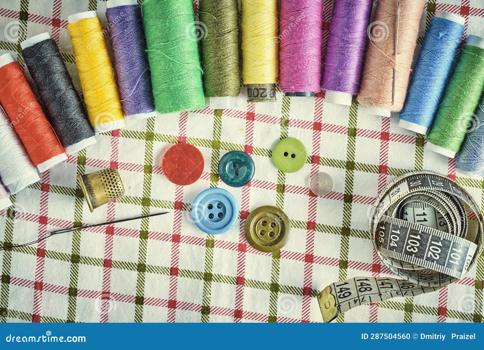 Sewing Kit Consisting Needle, Thimble, Threads and Measuring Meter on a