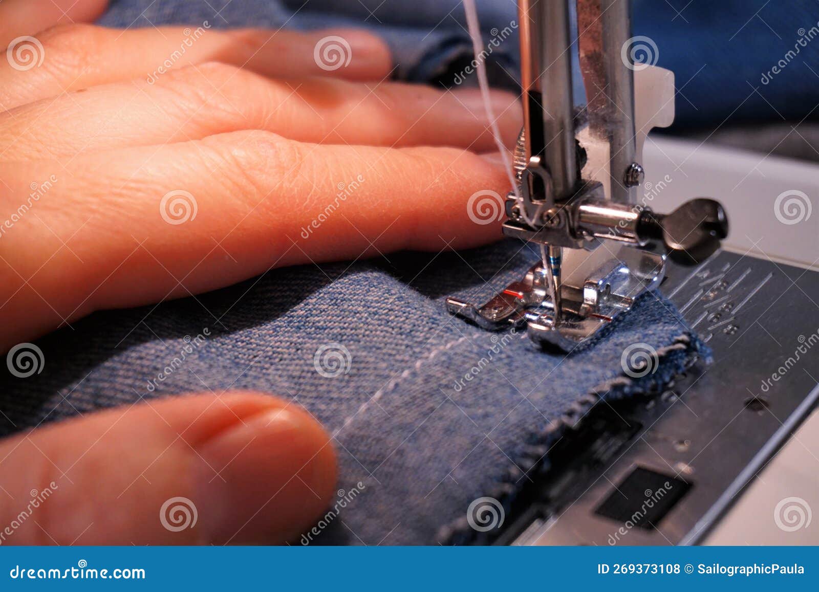 Sewing Machine with Fabric Being Sewn by Needle and Thread. a Textile