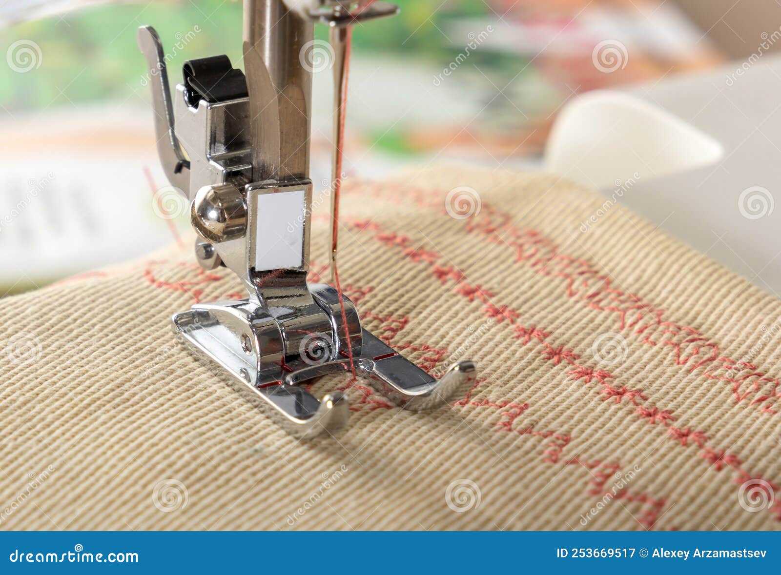 Sewing Machine Foot with a Needle Sews Fabric. Closeup Stock Image