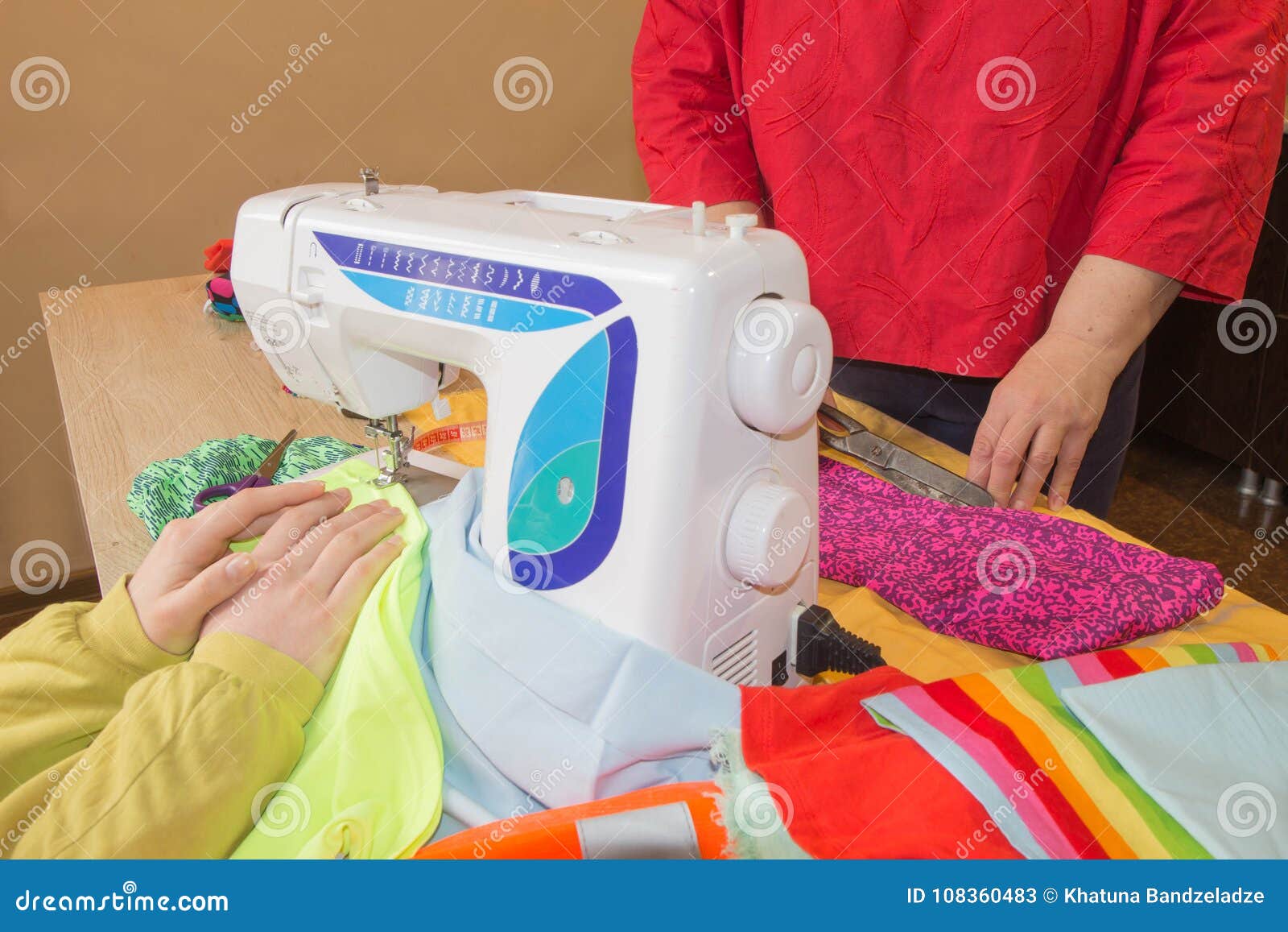 Sewing Machine.sewing Process In The Phase Of Overstitching. Dressmaker