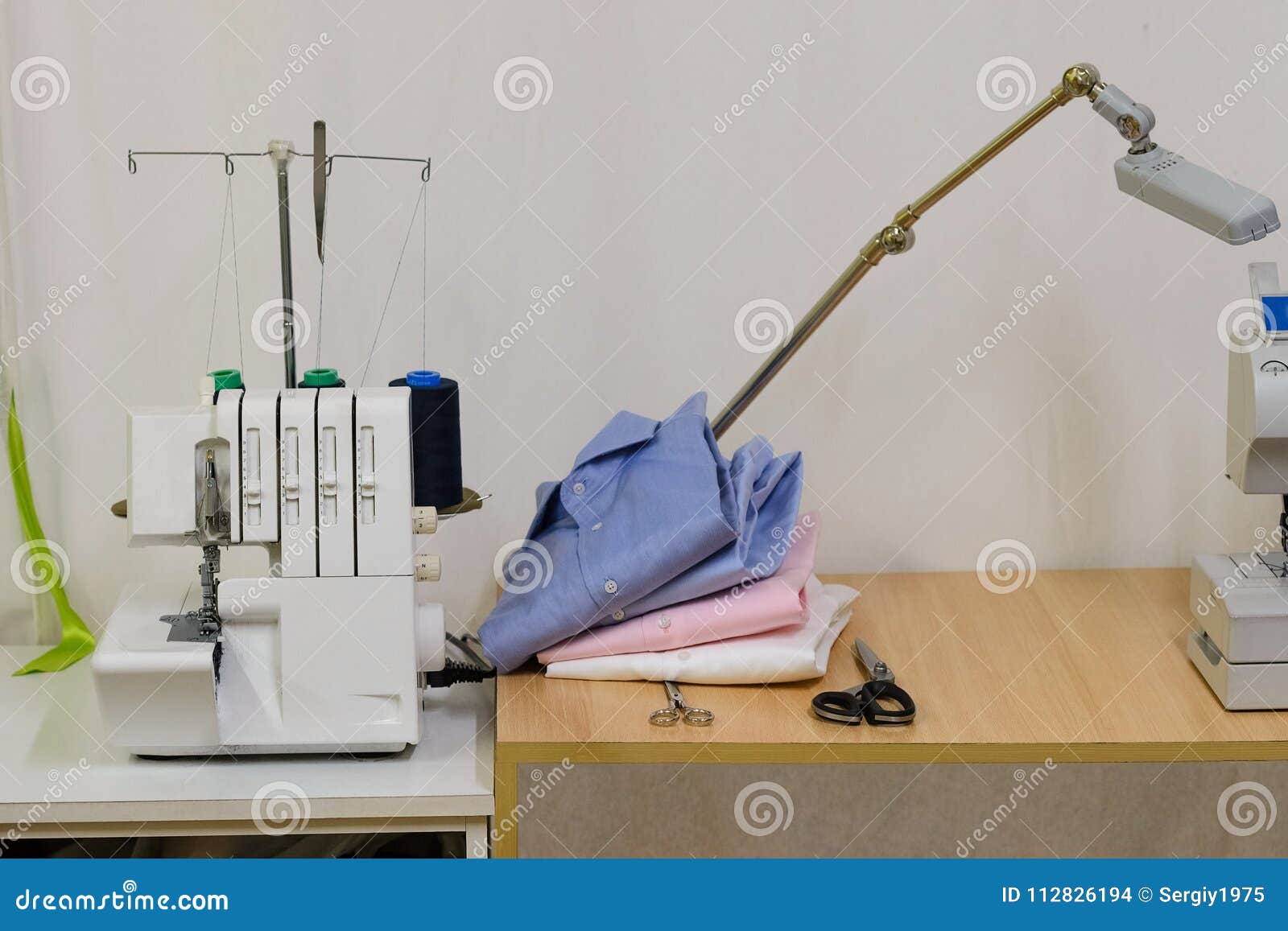 Sewing Machine and Shirts in a Sewing Studio Stock Photo Image of