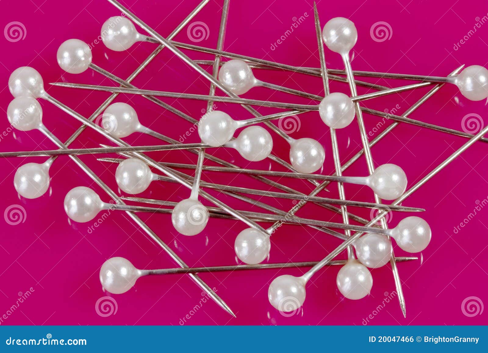 Sewing Pins on a Pink Background. Stock Photo Image of head, colorful