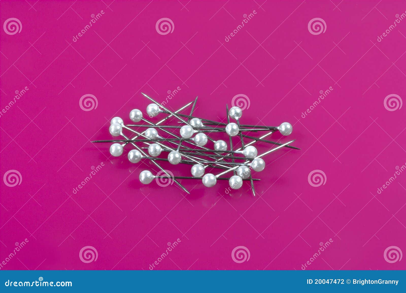 closeup-colourful-little-glass-tipped-sewing-pins-scattered-white