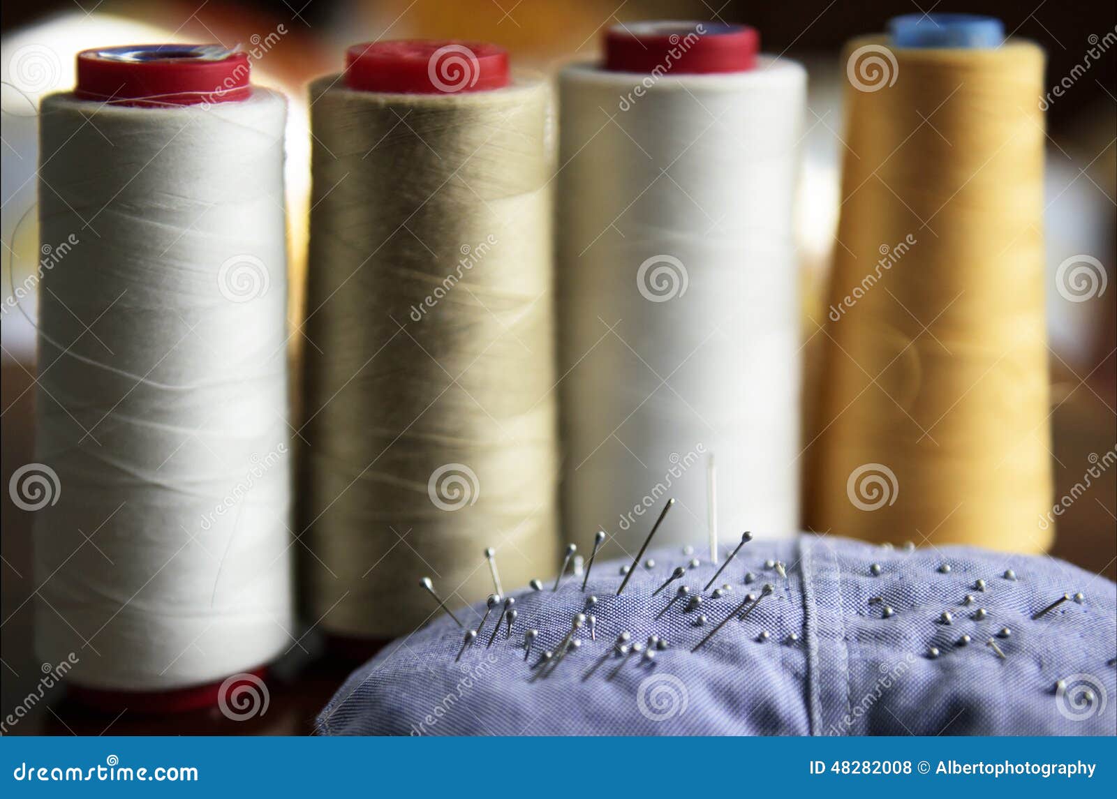 Sewing rolls and needles stock photo. Image of colored 48282008