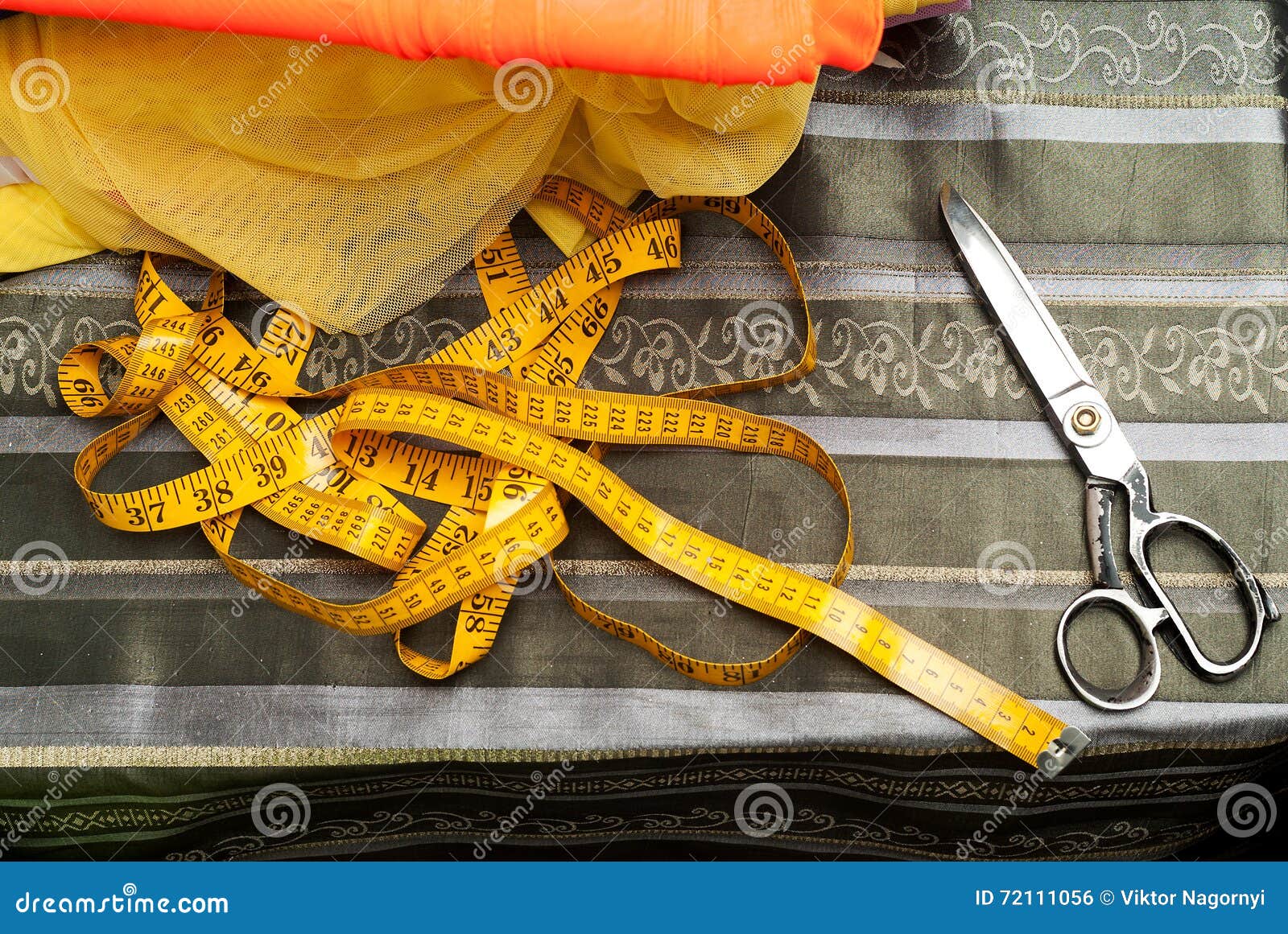 Sewing Textile or Cloth. Work Table of a Tailor. Textile Tools. Scissors, Measuring Tapes. Top