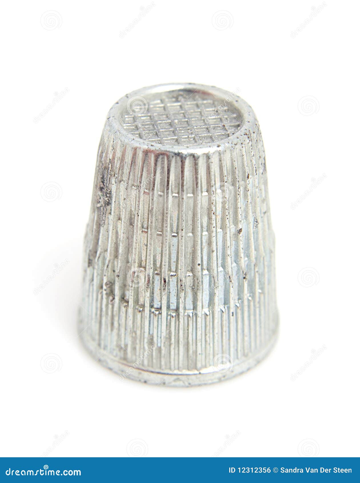 Sewing thimble in closeup stock photo. Image of stitch 12312356