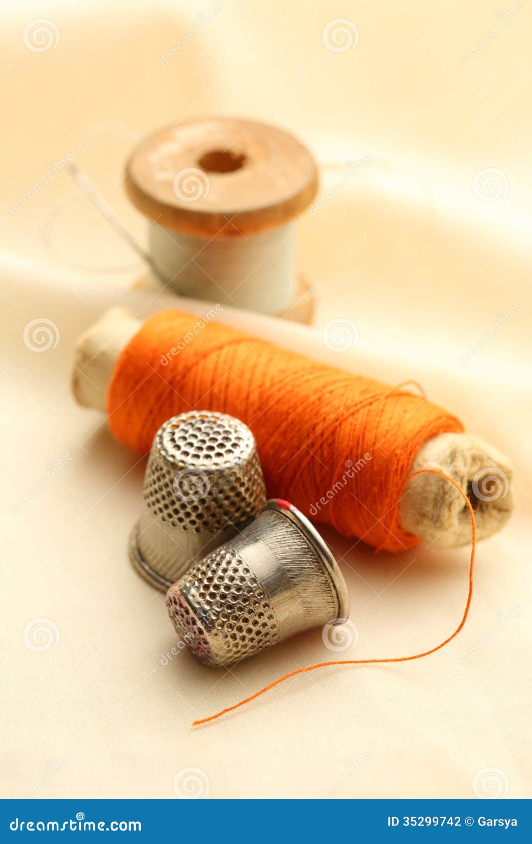 Sewing Thimbles, Bobbin and Needle Stock Photo Image of metal, spool