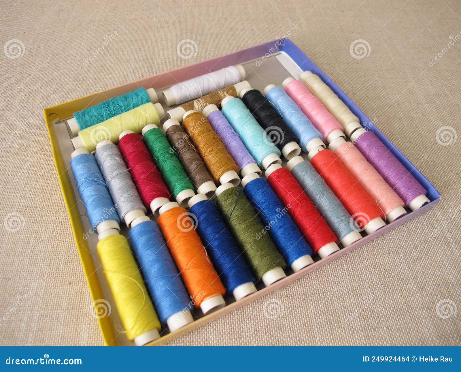 Sewing thread in a box stock photo. Image of bobbin 249924464