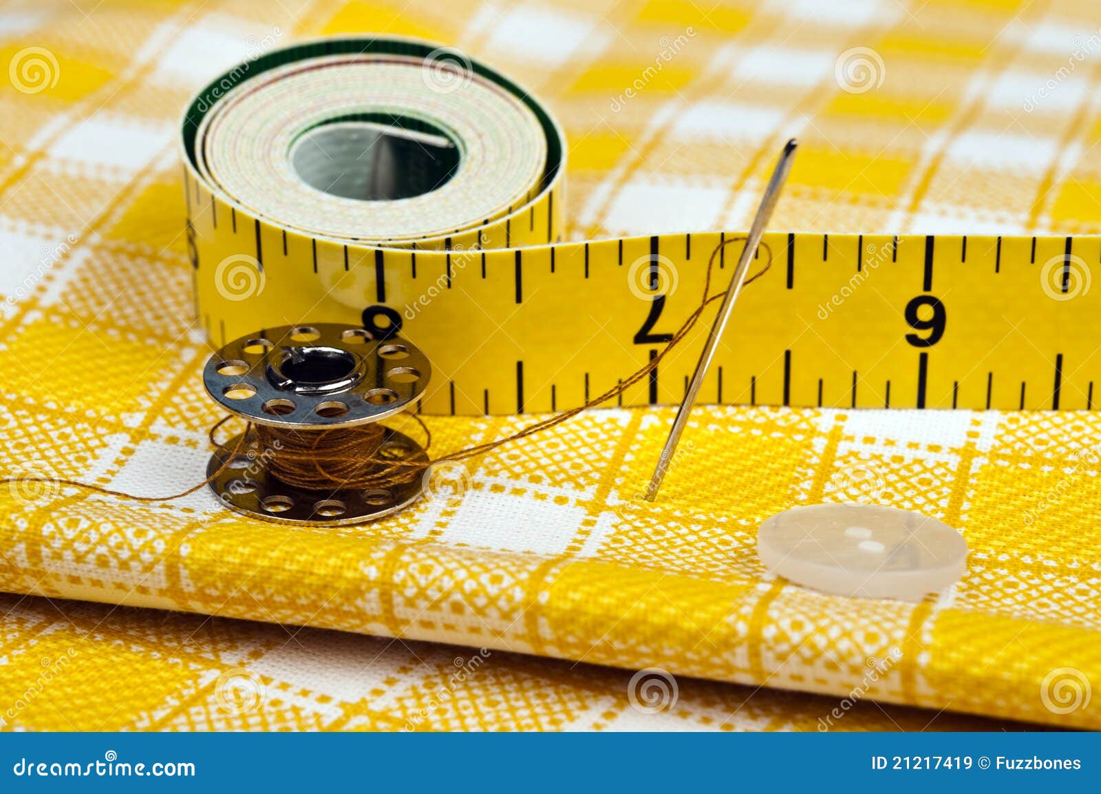 Yellow Bobbin Needle And Sewing Button Stock Photo - Download