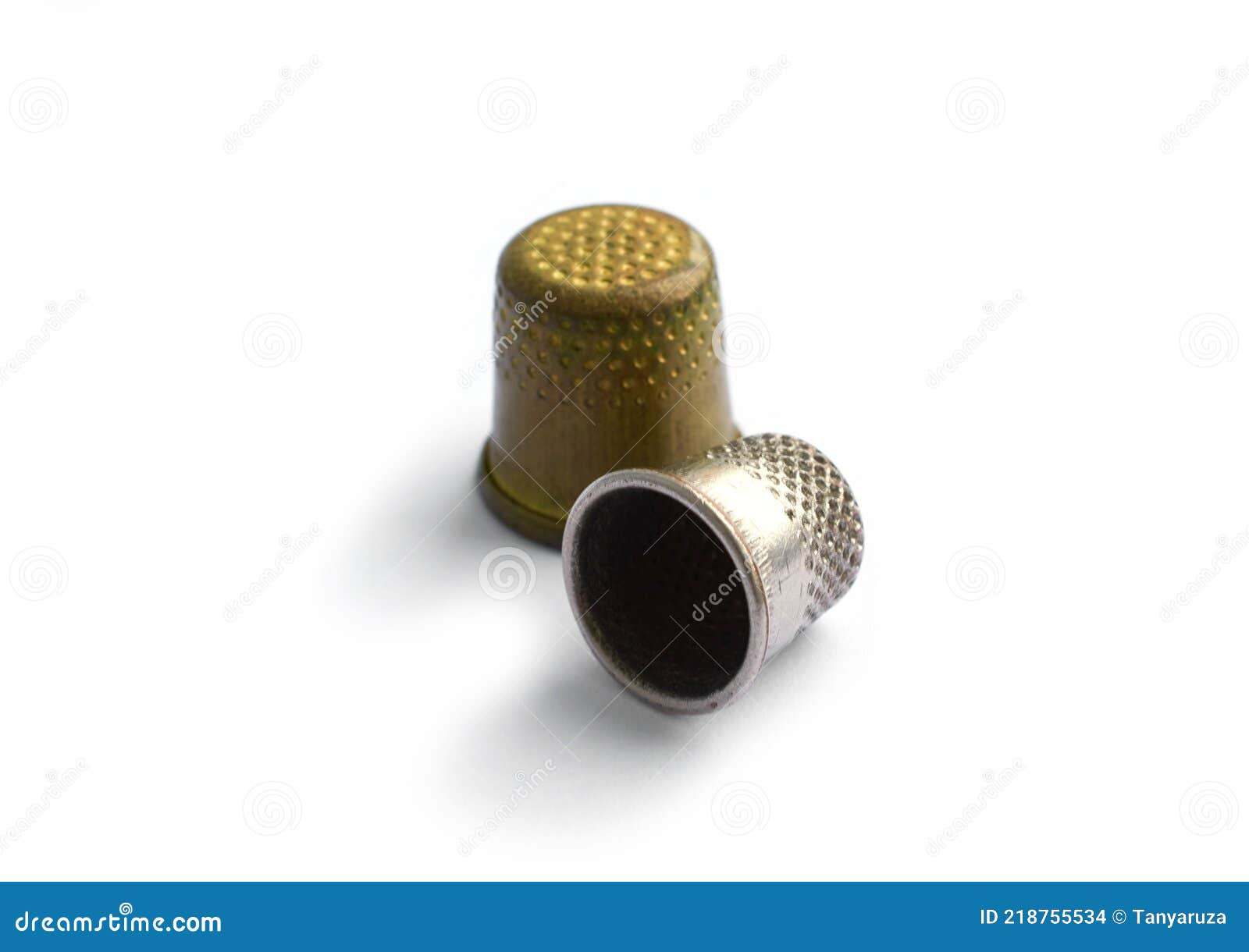 Sewing Tools. Two Vintage Thimbles Isolated on a White Background with