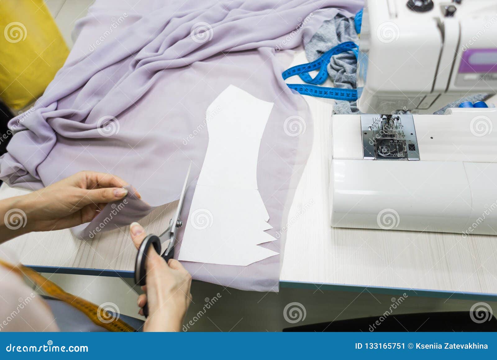 Sewing Workshop. Seamstress at Work. Marking and Cutting Fabric. Stock ...