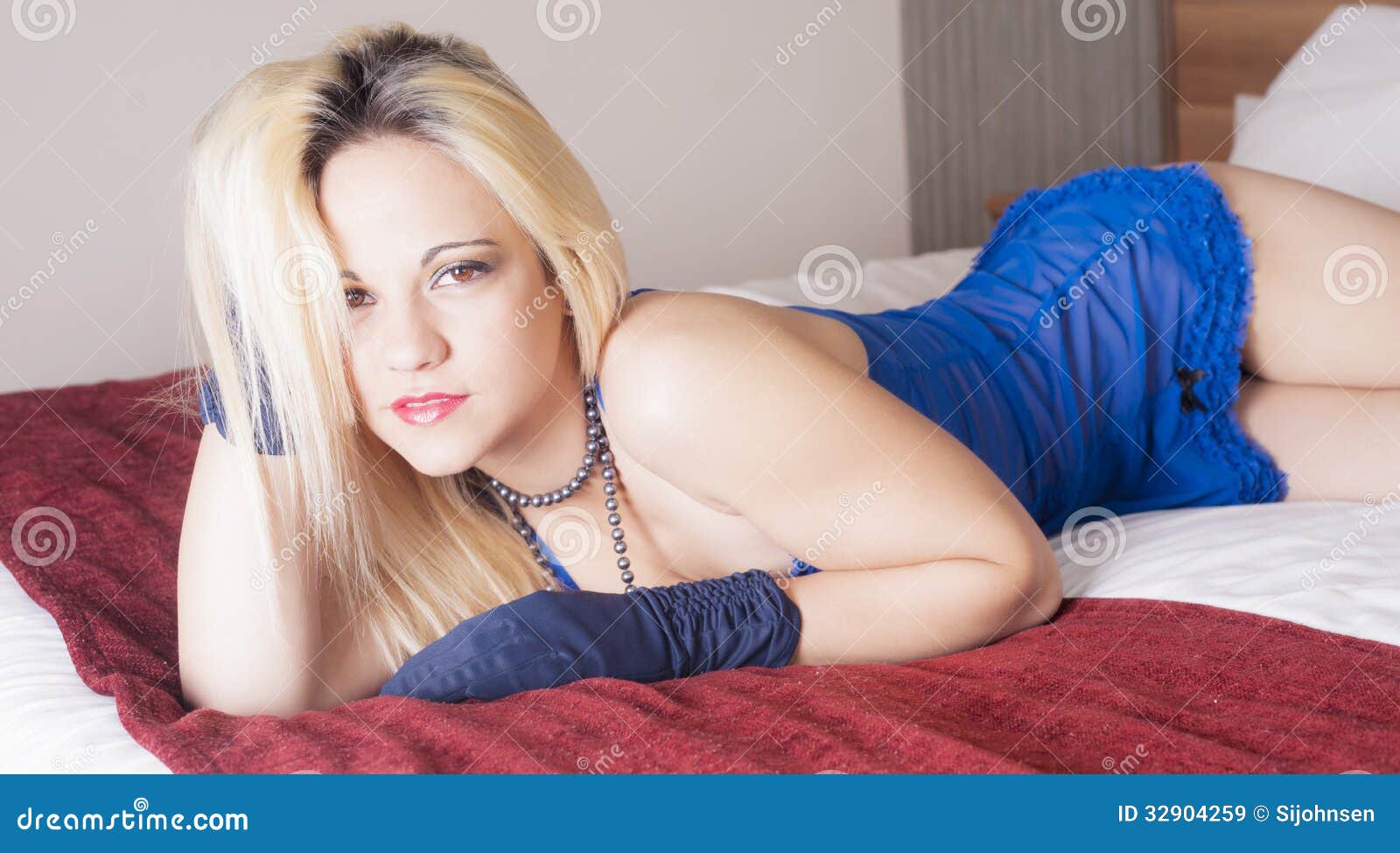 Sex blonde on bed stock image
