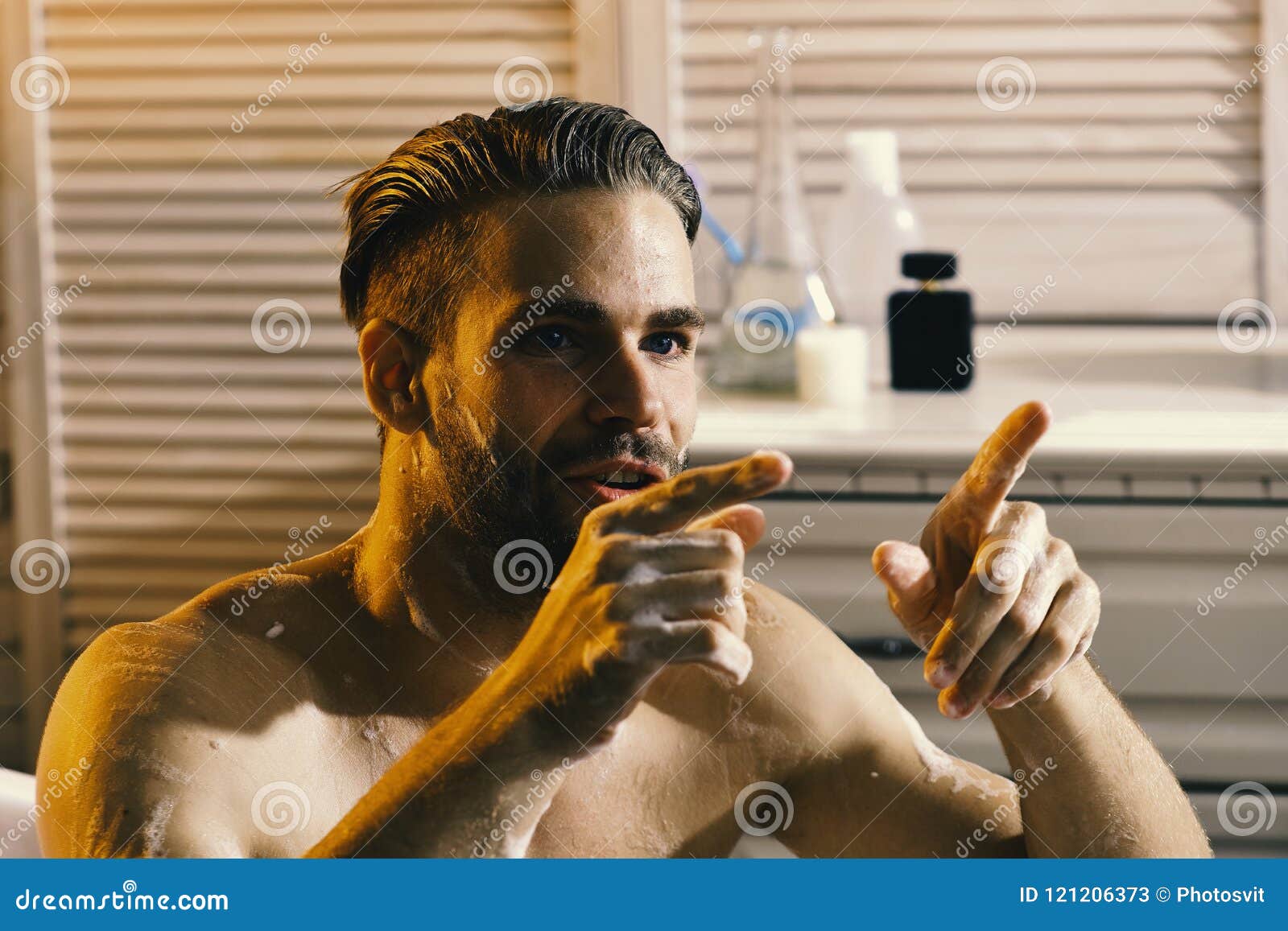 sex and erotica concept: guy in bathroom with involved look