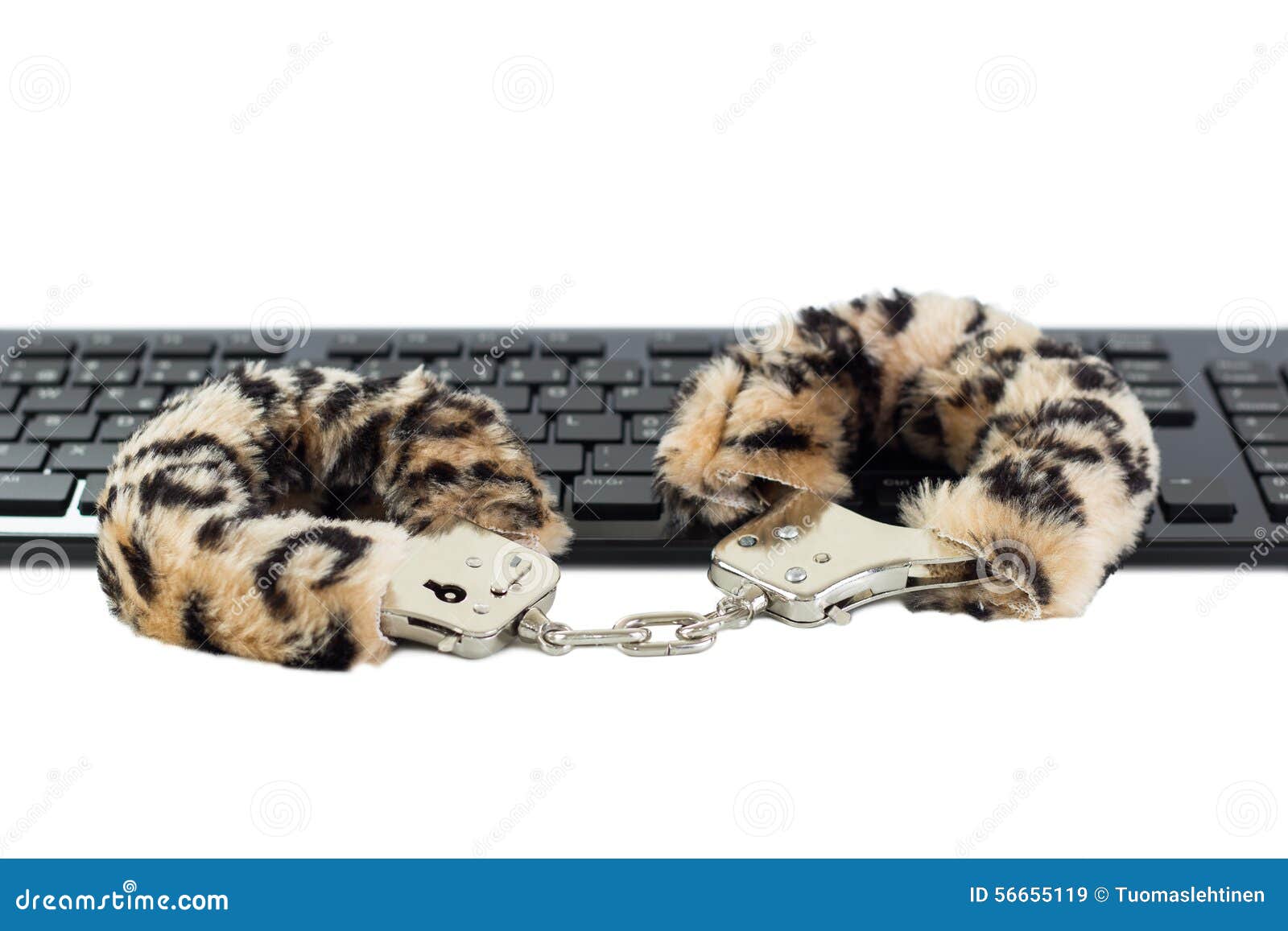 White Furry Kitten Porn - Sex Toy Handcuffs On A Keyboard Stock Image - Image of ...