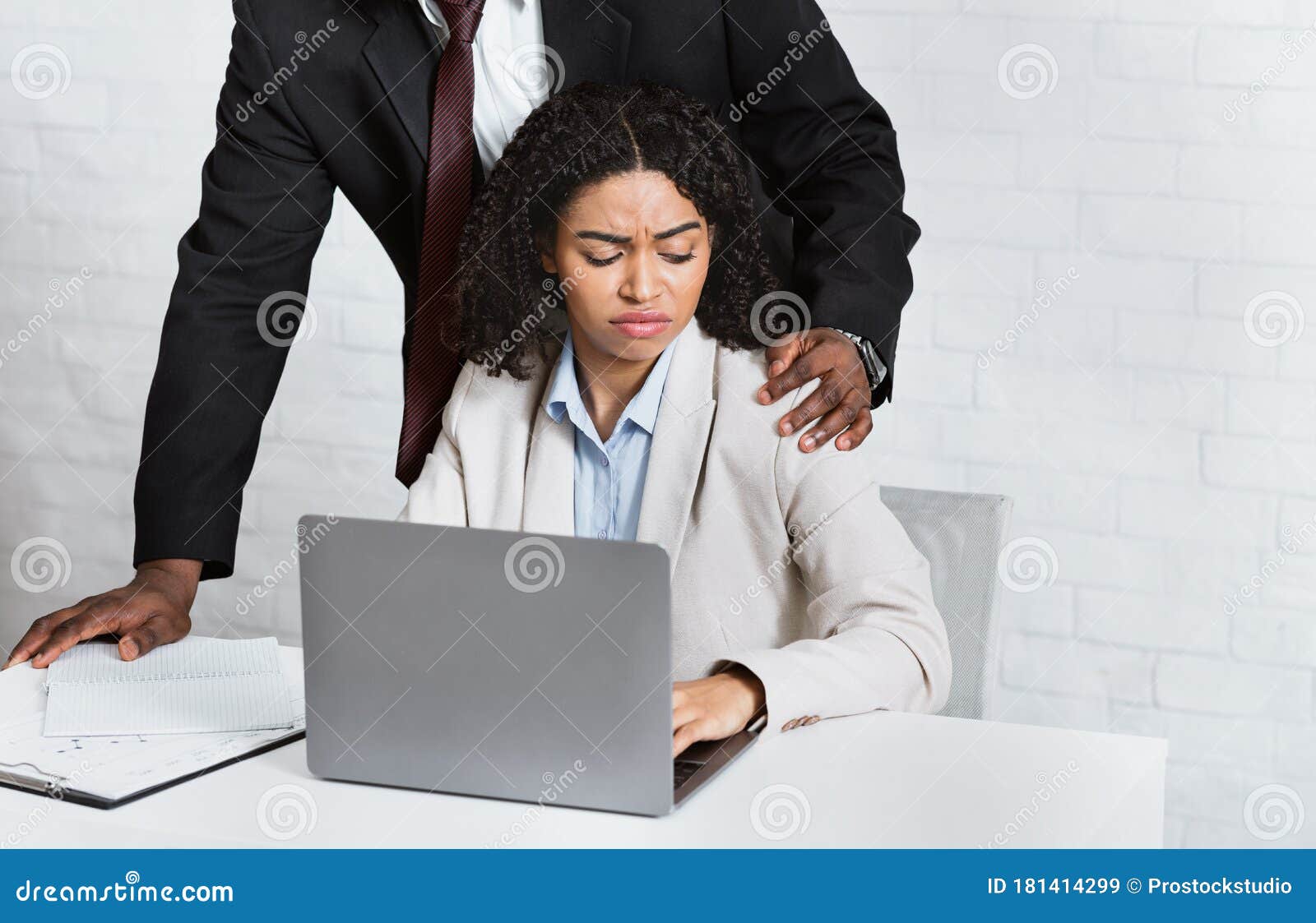 Harassment With A Boss Touching The Arm To His Secretary Who Is Sitting In His Workplace At